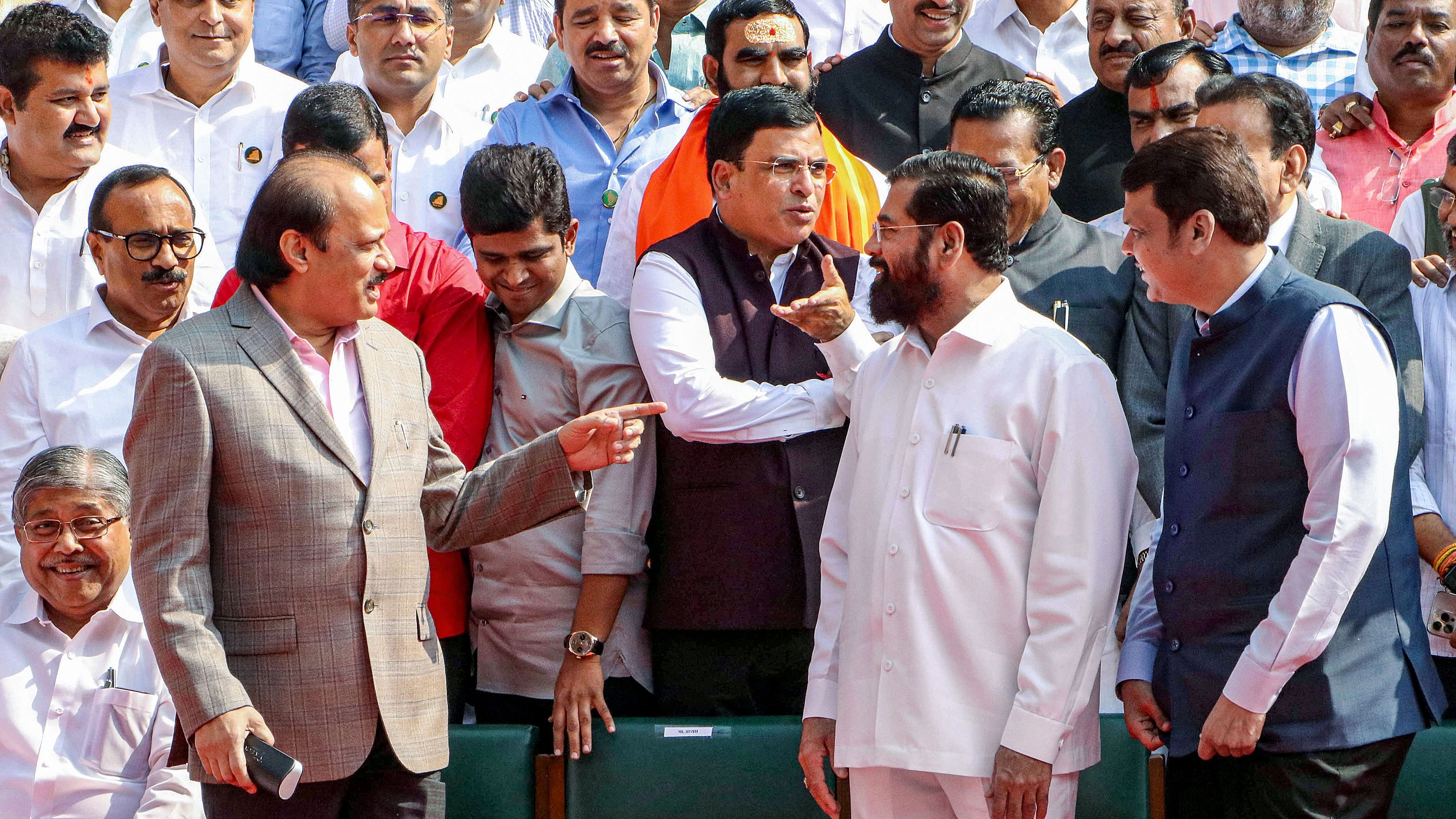 <div class="paragraphs"><p>Maharashtra Chief Minister Ekhnath Shinde, Deputy Chief Ministers Devendra Fadnavis and Ajit Pawar and MLAs during a group photo outside the Vidhan Bhavan during the Winter Session of the Maharashtra Assembly, in Nagpur, Thursday, Dec 14, 2023. </p></div>