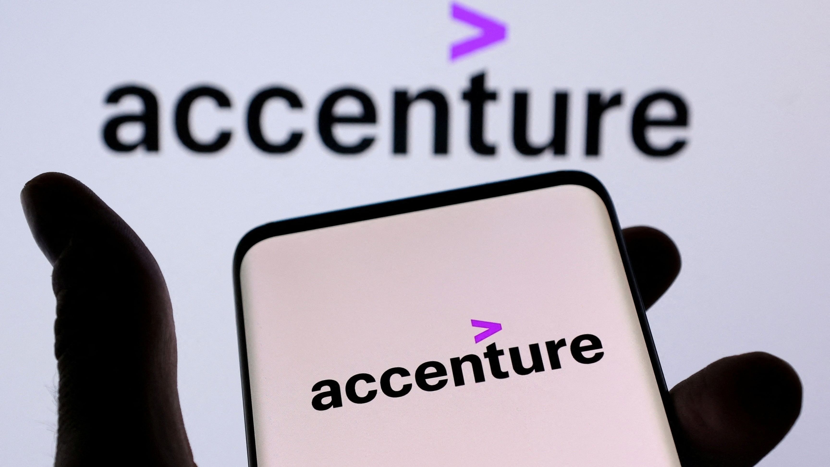 <div class="paragraphs"><p>Accenture PLC logo is seen on a smartphone in front of displayed same logo.</p></div>