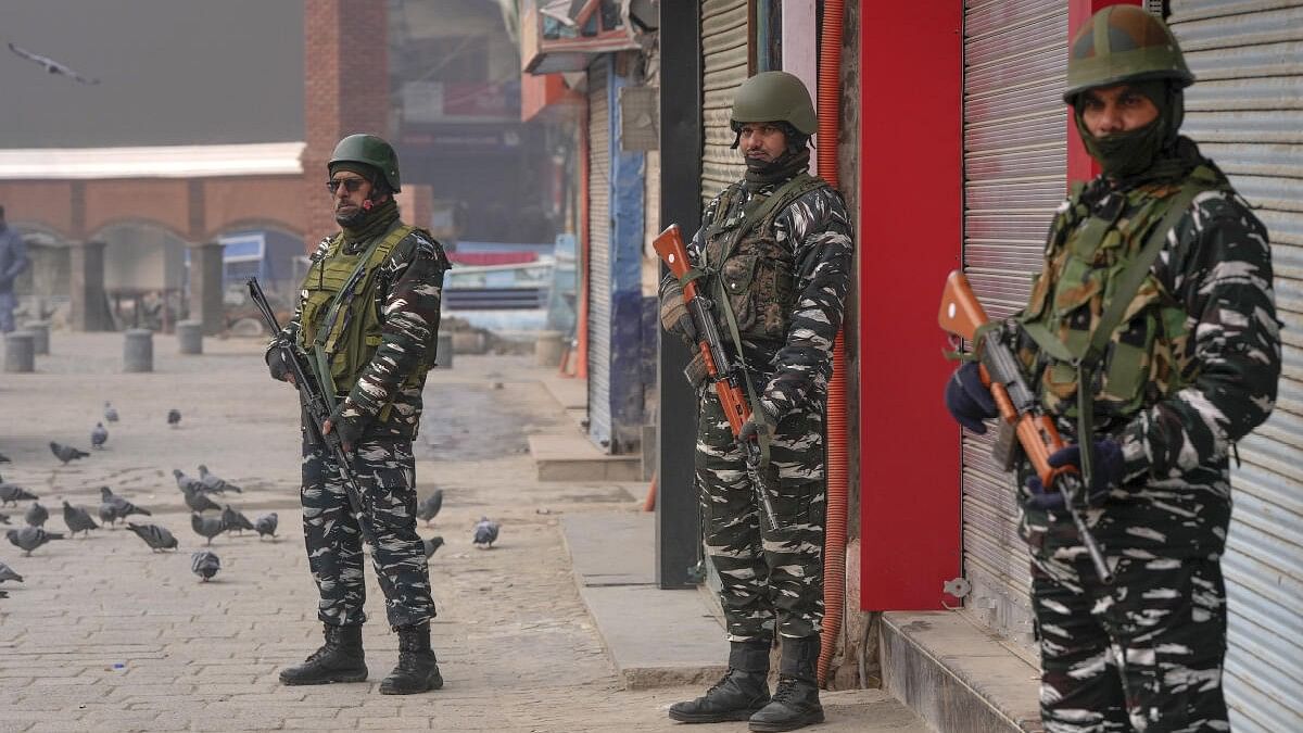 <div class="paragraphs"><p>Security personnel stand guard at Lal Chowk after security was beefed up on the day of the Supreme Court's verdict on a batch of petitions challenging the abrogation of Article 370 of the Constitution, in Srinagar.&nbsp;</p></div>