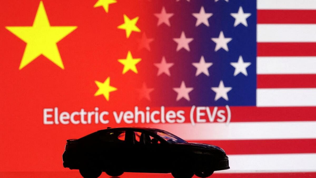 <div class="paragraphs"><p>Representative image with US, China flags and an EV</p></div>