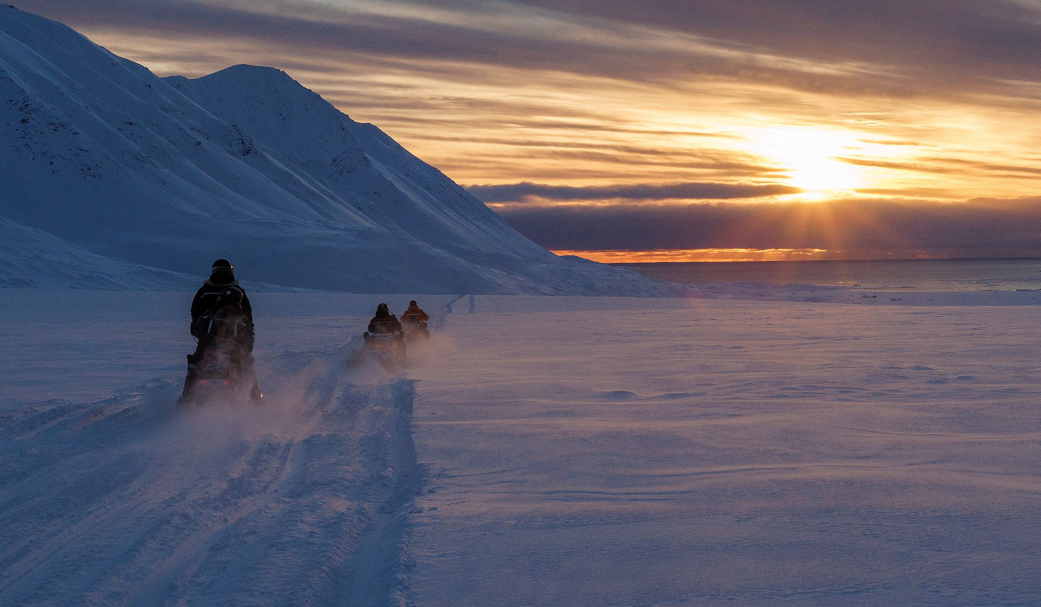 <div class="paragraphs"><p>File Photo: Scientists drive their snowmobiles across the Arctic towards Kongsfjord during sunset near Ny-Alesund, Svalbard, Norway, April 10, 2023. </p></div>