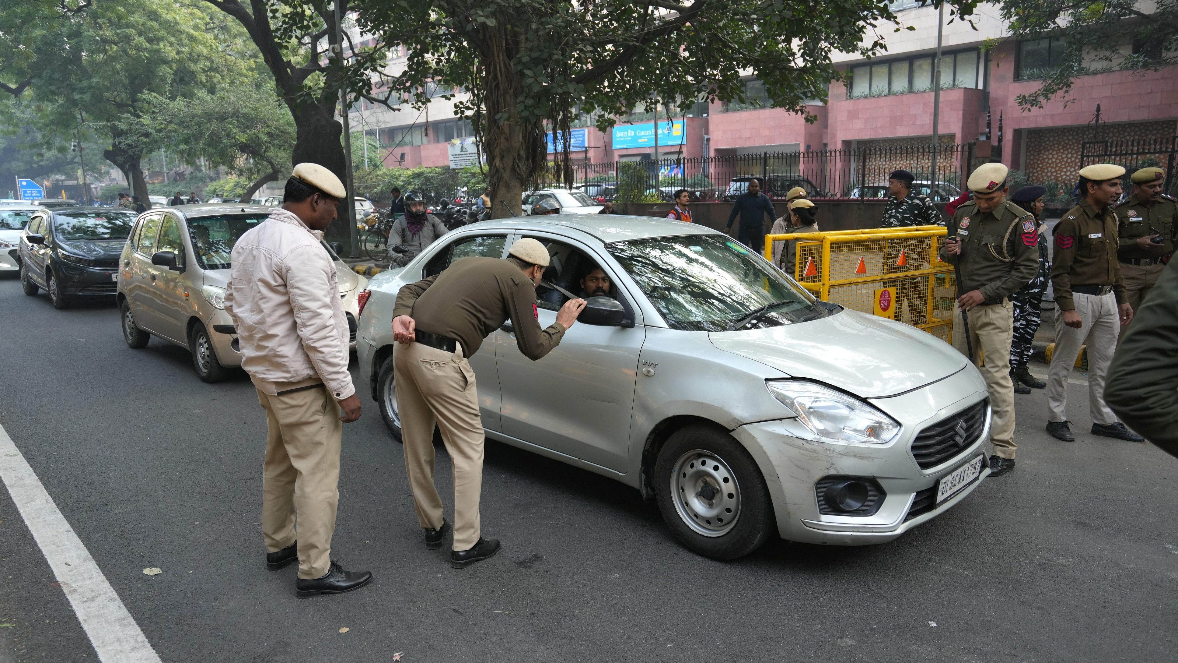 <div class="paragraphs"><p>Security personnel check a vehicle near the Parliament House after a security breach on the anniversary of the 2001 Parliament terror attack on Wednesday, in New Delhi.&nbsp;</p></div>