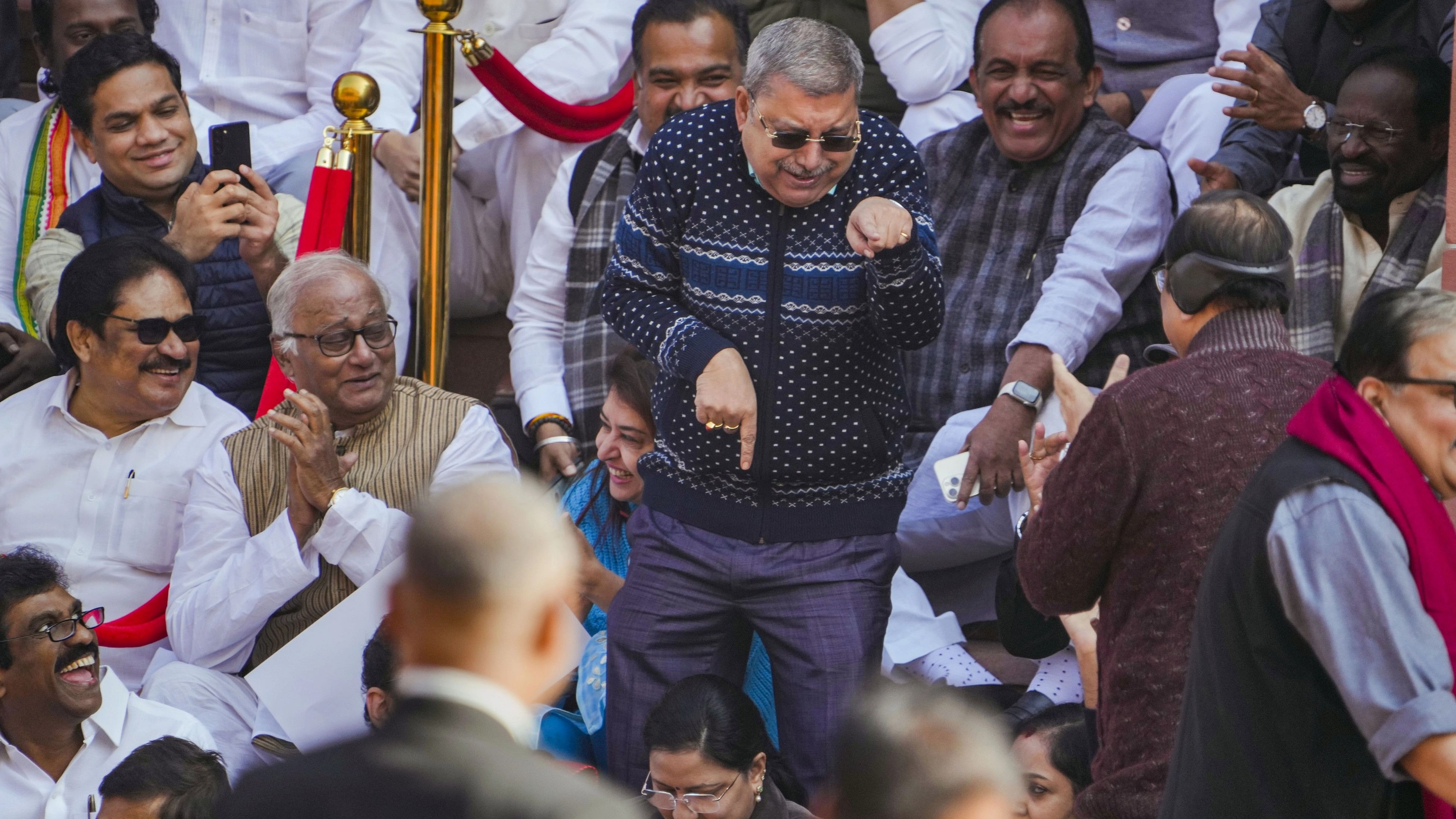 <div class="paragraphs"><p>TMC's Kalyan Banerjee mimicks Rajya Sabha Chairman Jagdeep Dhankhar while staging a protest along with other suspended MPs during the Winter session of Parliament, in New Delhi, Tuesday, Dec 19, 2023.</p></div>