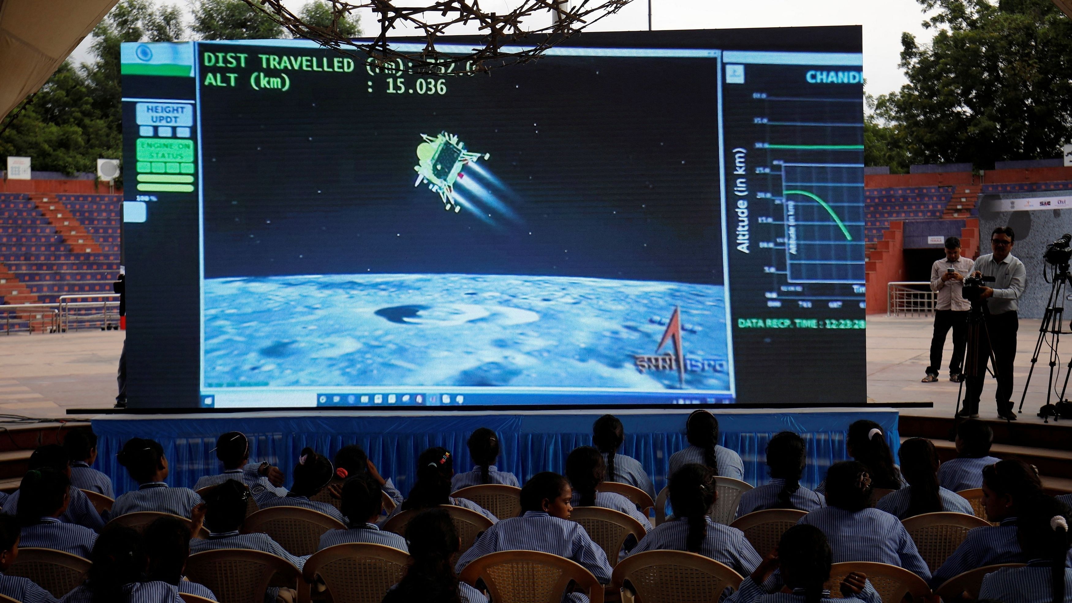 <div class="paragraphs"><p>People watch a live stream of Chandrayaan-3 spacecraft's landing on the moon, inside an auditorium of Gujarat Science City in Ahmedabad, India, August 23, 2023. </p></div>