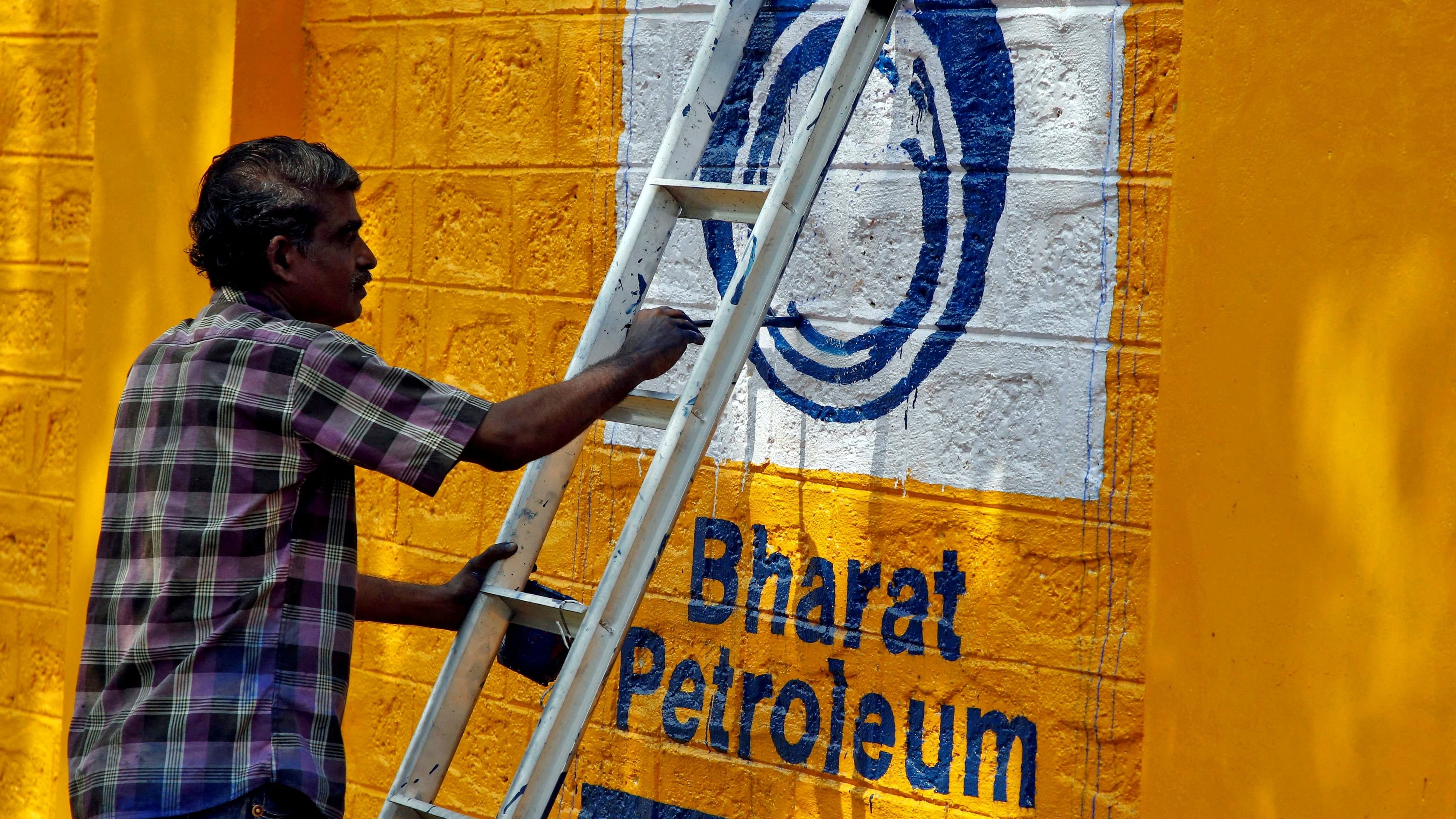<div class="paragraphs"><p>A man paints the logo of oil refiner Bharat Petroleum Corp on a wall.</p></div>