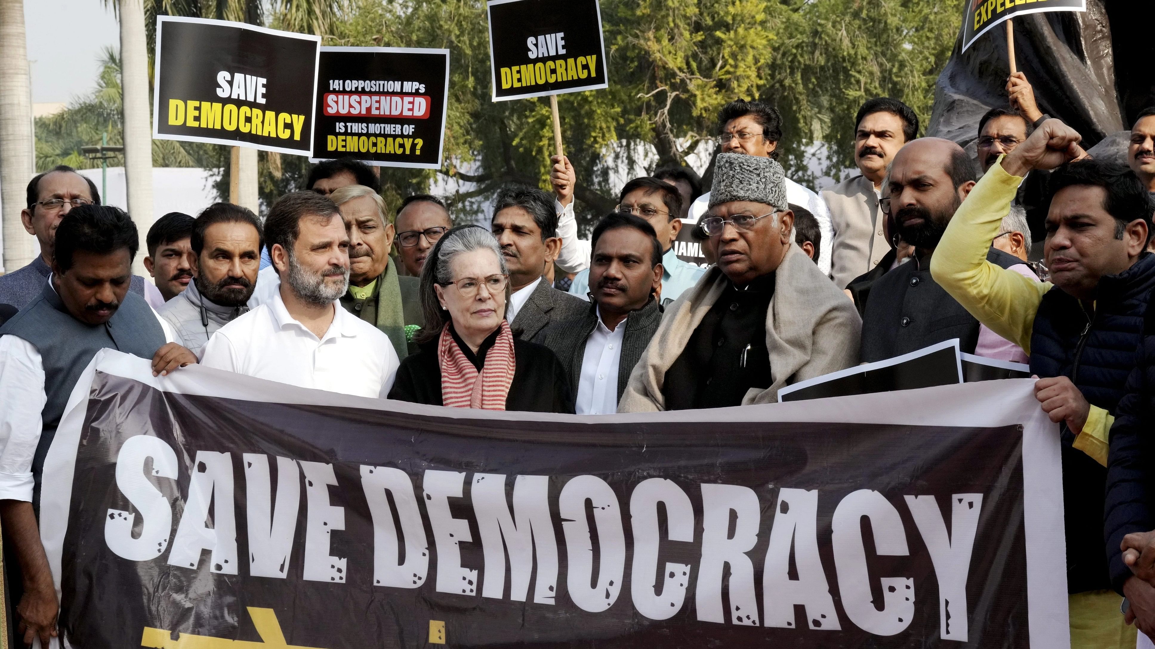 <div class="paragraphs"><p>Congress President Mallikarjun Kharge with party leaders Sonia Gandhi and Rahul Gandhi and other opposition leaders during a protest over the suspension of MPs amid the Winter session of Parliament, in New Delhi, Wednesday, Dec 20, 2023</p></div>