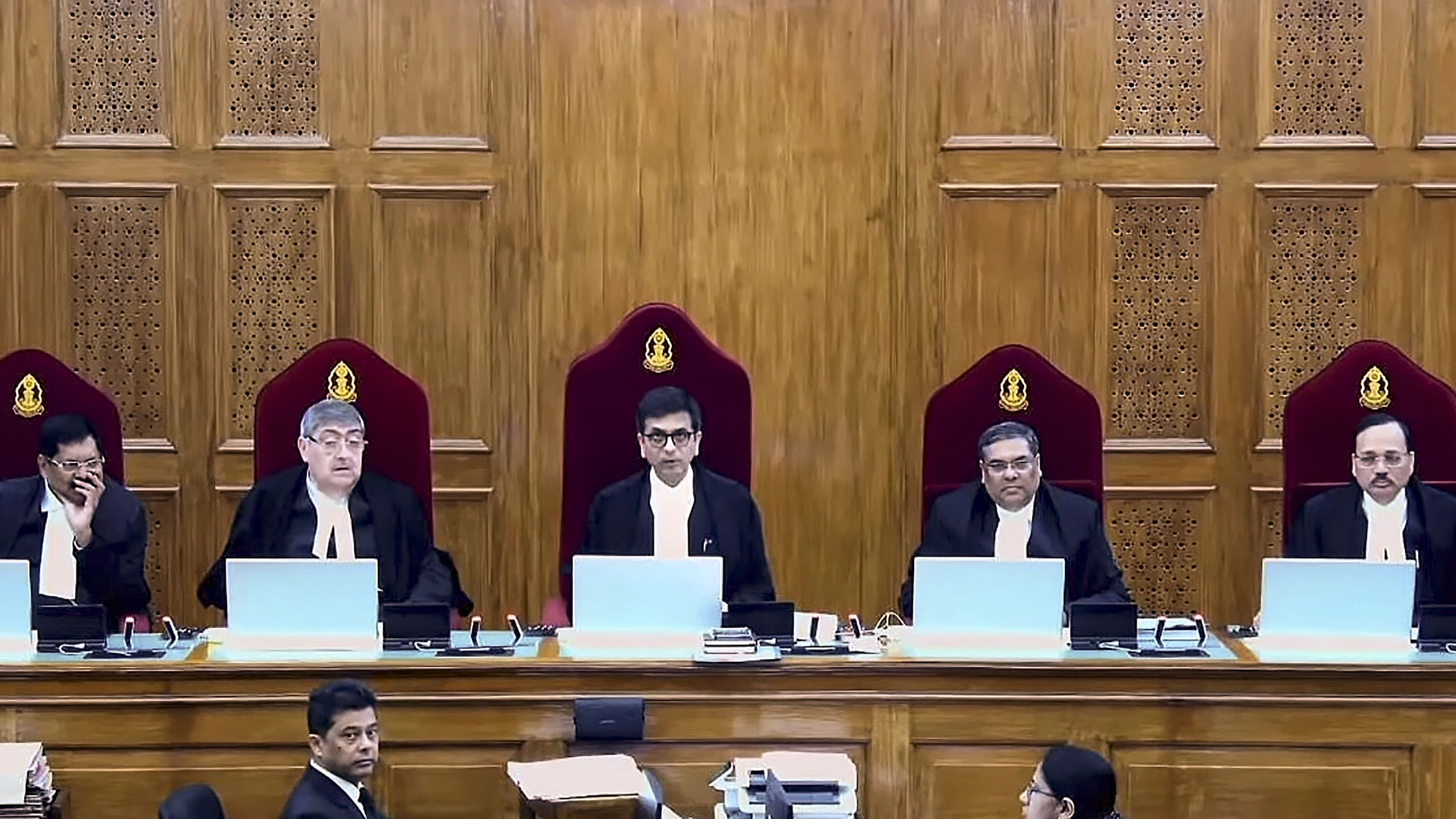 <div class="paragraphs"><p> The five-judge bench comprising Chief Justice DY Chandrachud and Justices Sanjay Kishan Kaul, Sanjiv Khanna, BR Gavai and Surya Kant during pronouncement of verdict on a batch of petitions challenging the abrogation of Article 370 of the Constitution, in New Delhi, Monday, Dec 11, 2023. </p></div>