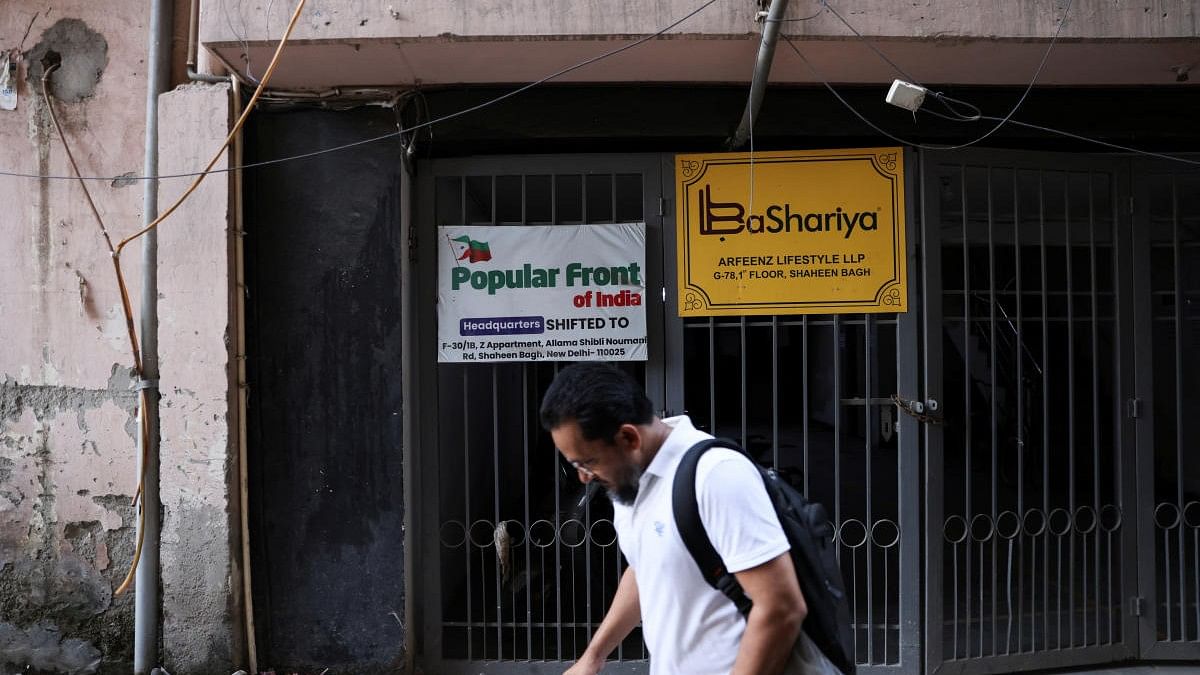 <div class="paragraphs"><p>A man walks past the old office of Popular Front of India (PFI) Islamic group, in New Delhi, India, September 28, 2022.</p></div>