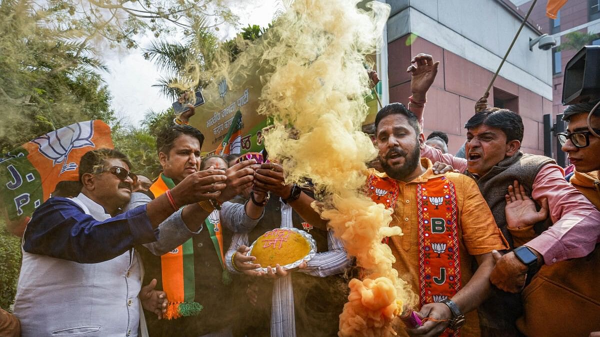 <div class="paragraphs"><p>BJP workers and supporters celebrate the party's lead in Madhya Pradesh, Rajasthan and Chhattisgarh during counting of votes, at the party headquarters, in New Delhi.&nbsp;</p></div>