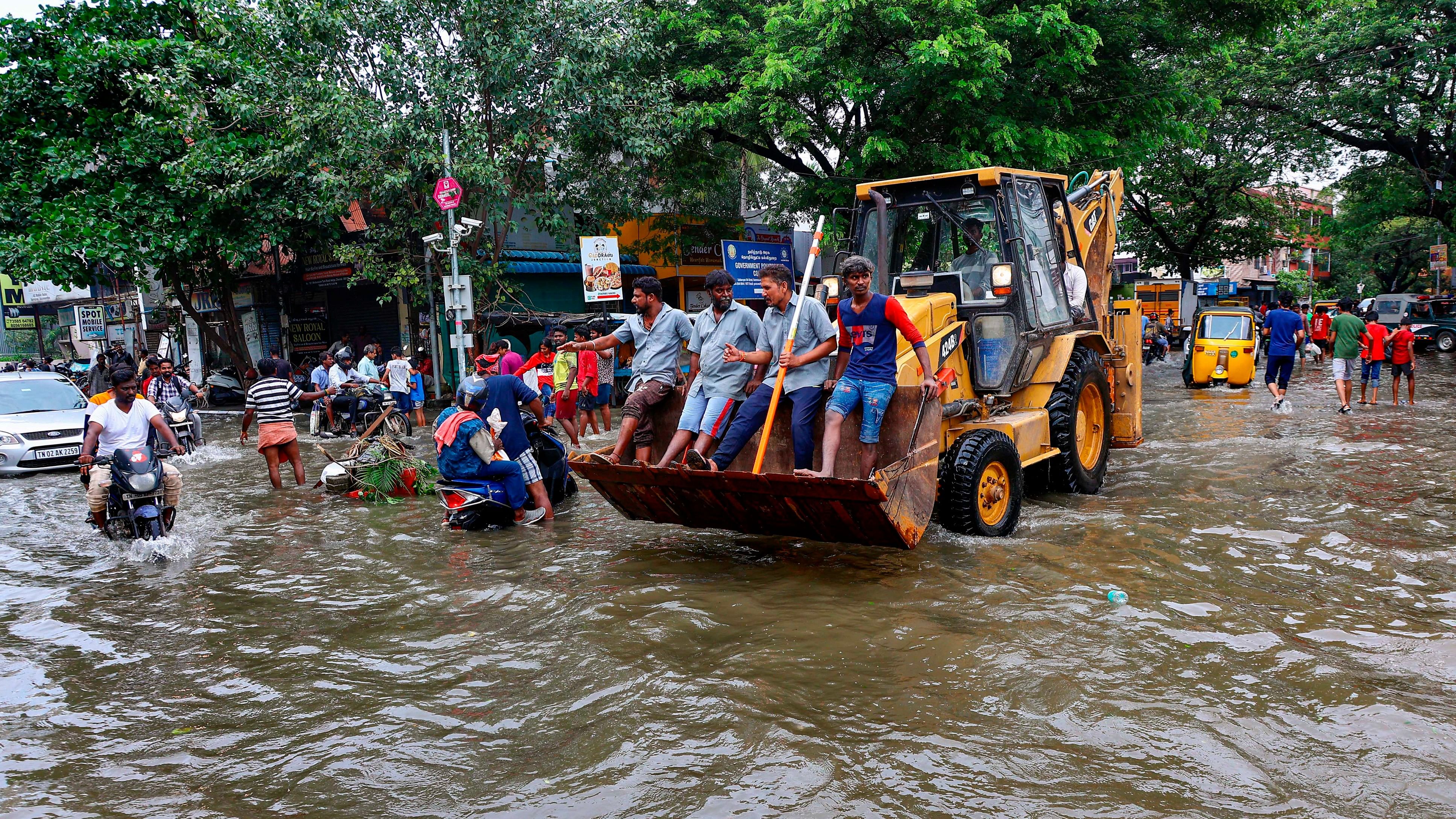 <div class="paragraphs"><p>Commuters on a flooded road after heavy rainfall owing to Cyclone Michaung, in Chennai, Tuesday, December 5, 2023.</p></div>