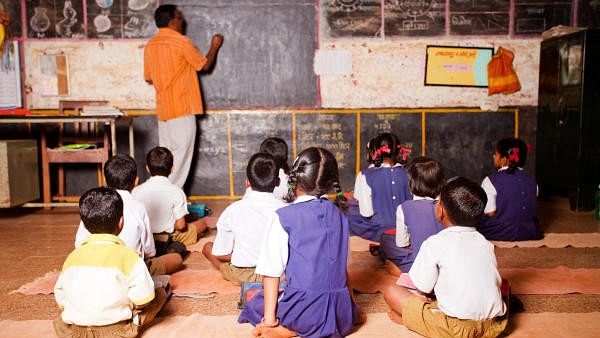 <div class="paragraphs"><p>Image of male teacher teaching in a rural school of India.</p></div>