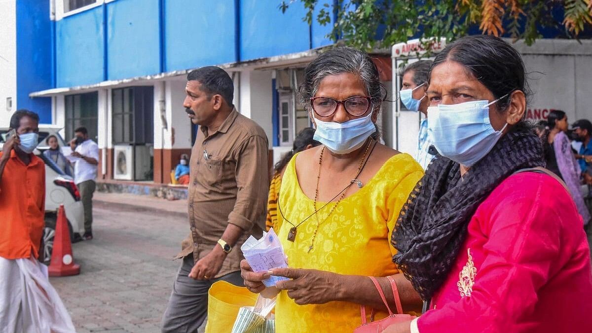 <div class="paragraphs"><p>Visitors wear masks at the Ernakulam Government Hospital after rise in number of Covid-19 cases, in Kochi.</p></div>