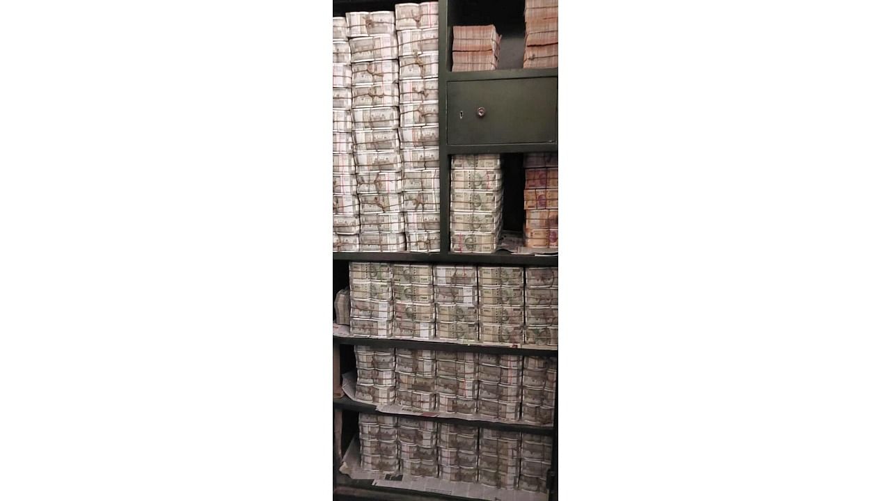 <div class="paragraphs"><p>Cash seized by the Income Tax department after raids against a Odisha-based distellery group and linked entities.</p></div>