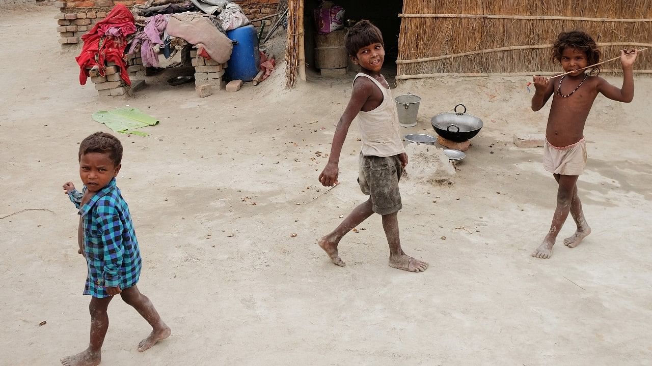 <div class="paragraphs"><p>Children showing signs of malnutrition play outside their home in Marwan village in the eastern state of Bihar, India.</p></div>