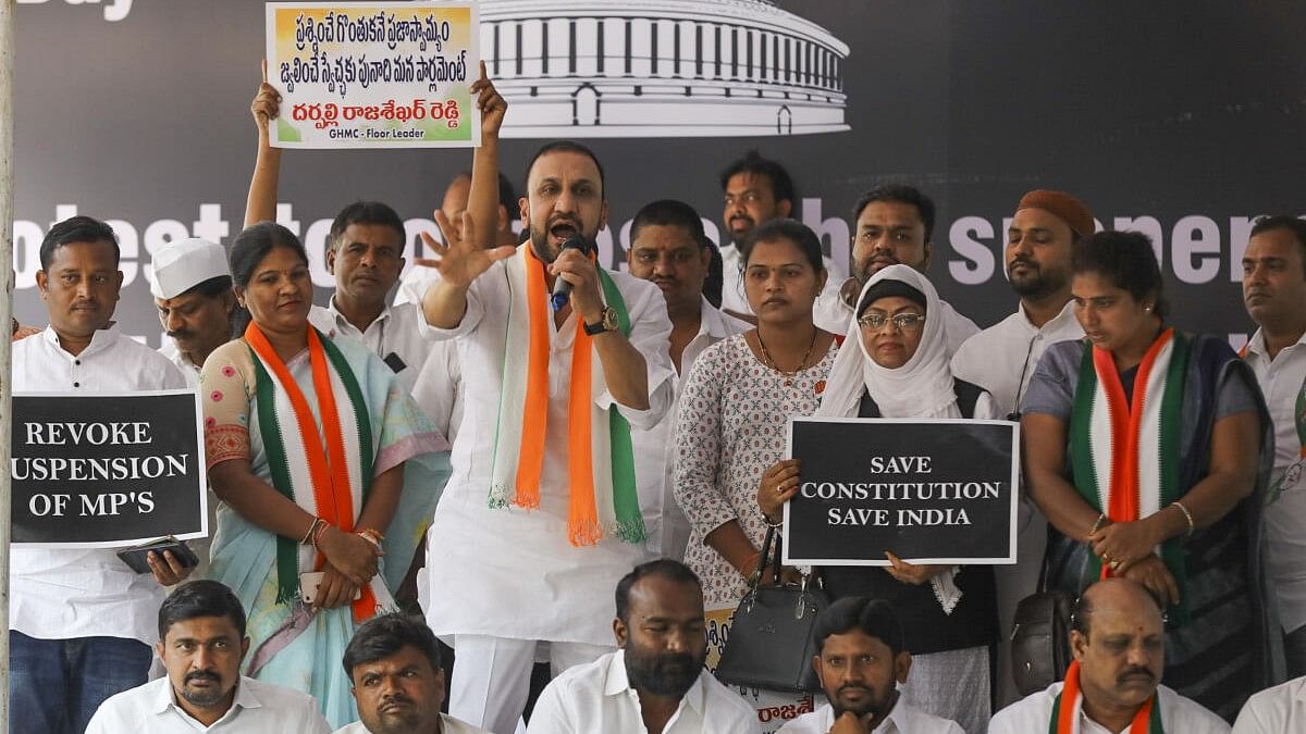 <div class="paragraphs"><p>Congress leader Mohammed Feroz Khan with party workers during a protest against the suspension of opposition MPs from Parliament during the Winter session, in Hyderabad.</p></div>