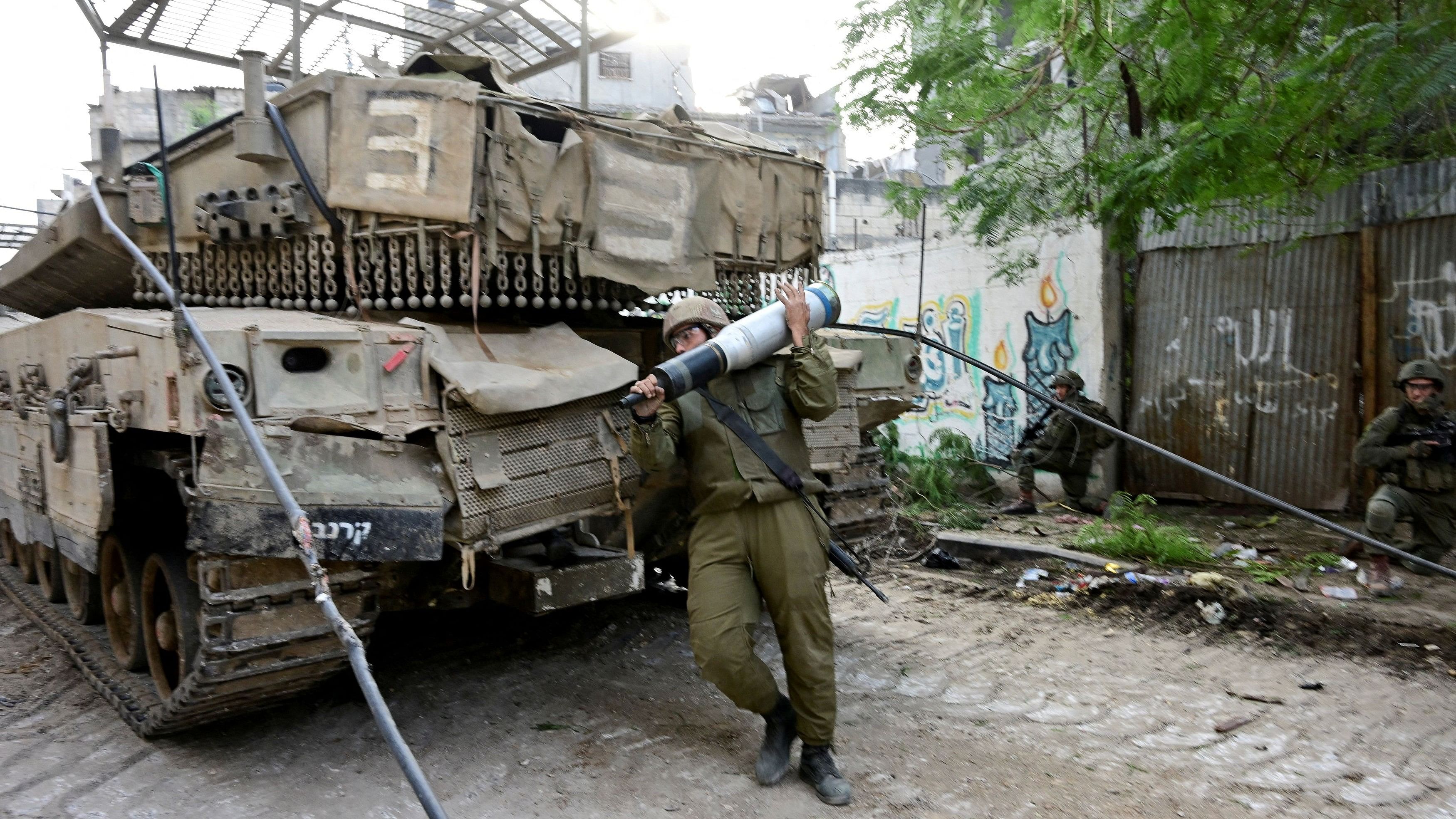 <div class="paragraphs"><p>Israeli soldiers operate at the Shajaiya district of Gaza city amid the ongoing conflict between Israel and the Palestinian Islamist group Hamas, in the Gaza Strip.</p></div>