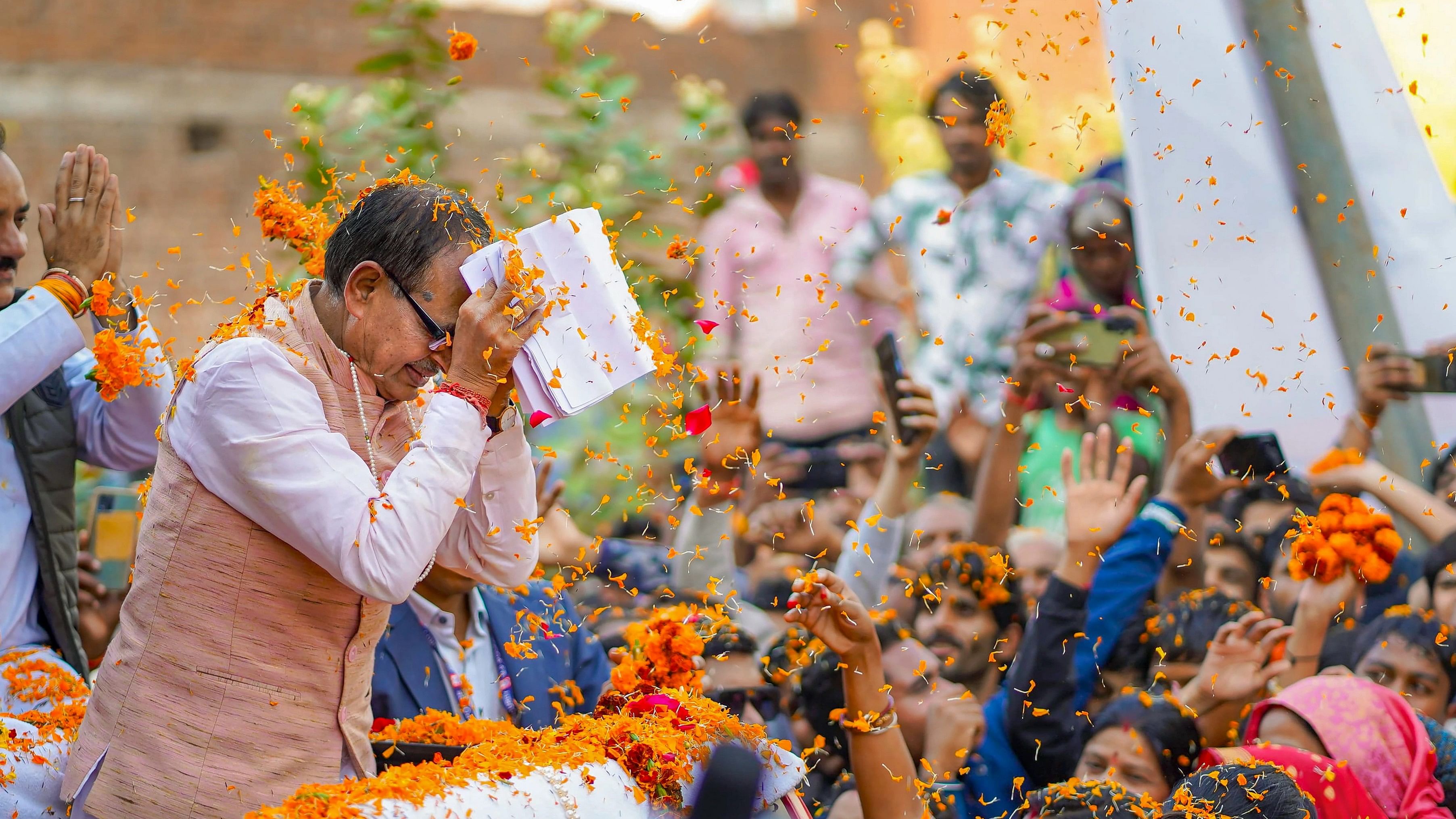 <div class="paragraphs"><p>Madhya Pradesh Chief Minister Shivraj Singh Chouhan greets supporters during his visit to Raghogarh, Friday, Dec. 8, 2023. </p></div>