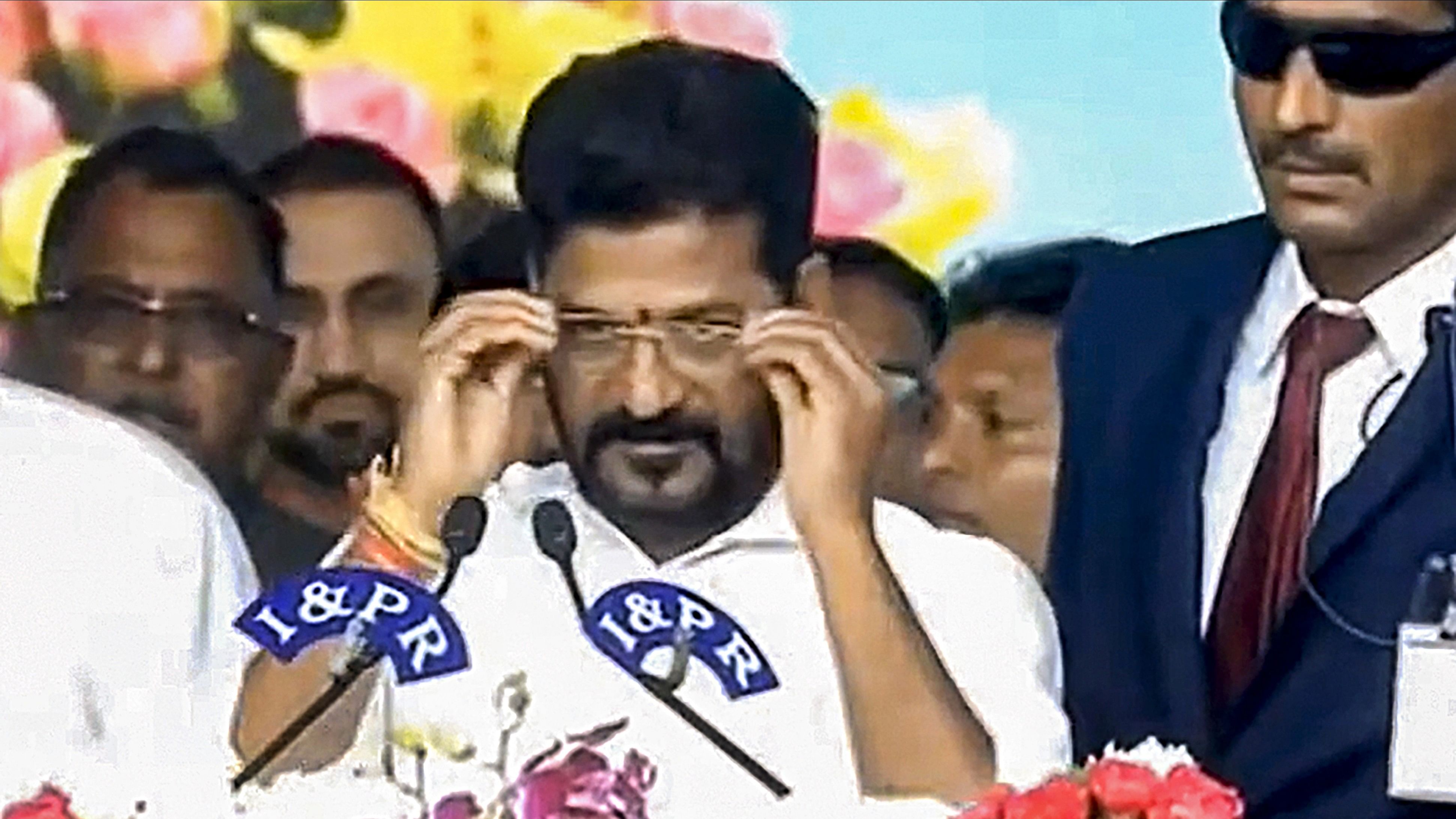 <div class="paragraphs"><p> Congress leader Revanth Reddy takes oath as Telangana Chief Minister administered by the state Governor Tamilisai Soundararajan, in Hyderabad, Thursday, Dec. 7, 2023.</p></div>