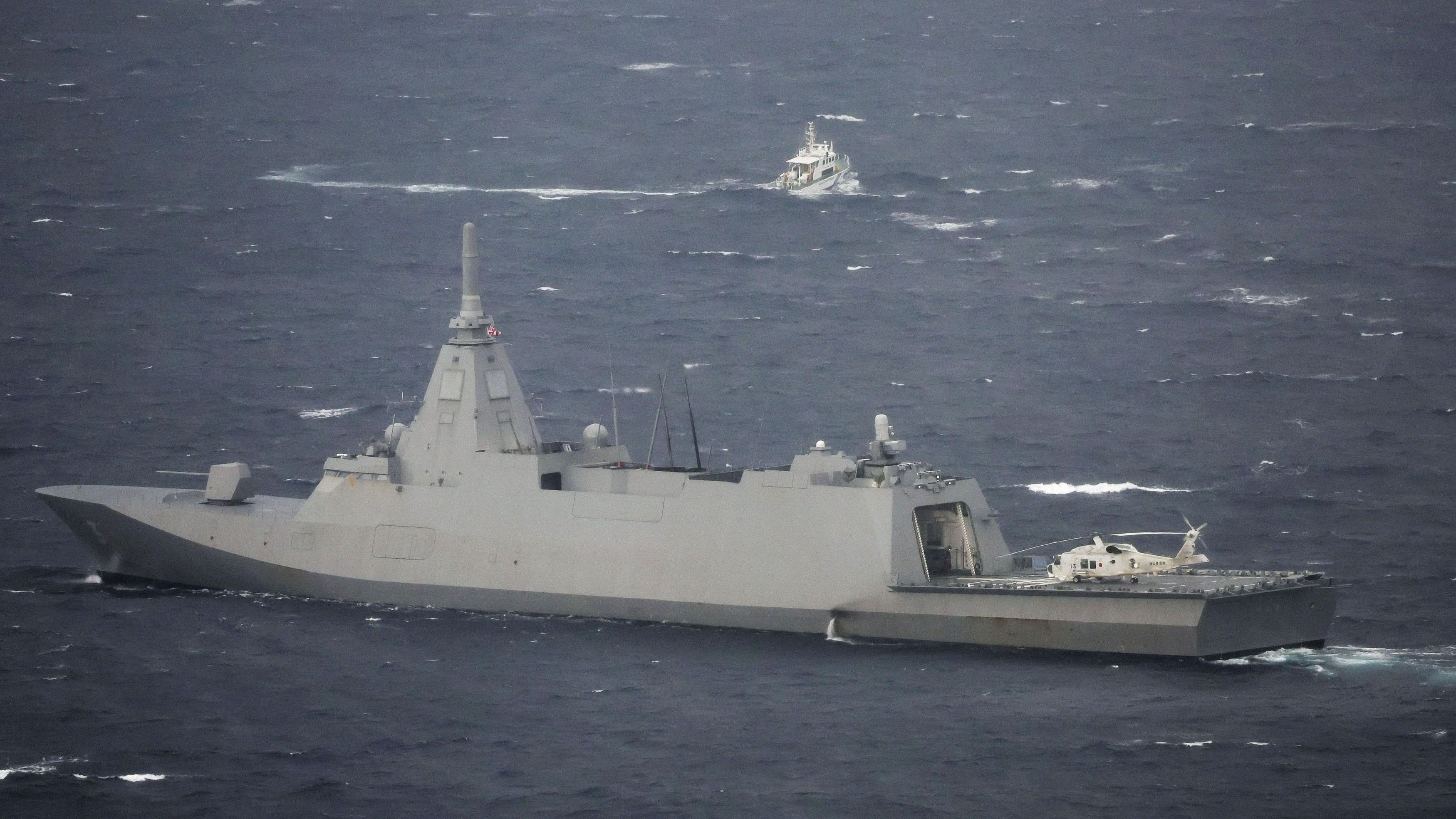 <div class="paragraphs"><p>Japan Maritime Self-Defense Force's frigate JS Noshiro  conducts a search and rescue operation at the site where a US military aircraft CV-22 Osprey crashed into the sea off Yakushima Island.</p></div>