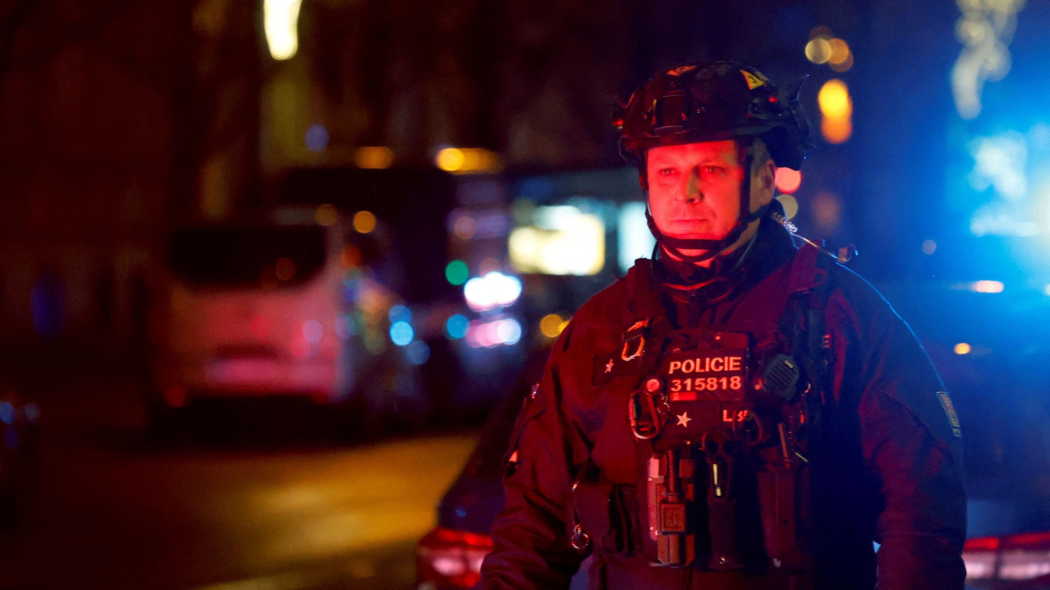 <div class="paragraphs"><p>A police officer secures the area following the shooting at one of the buildings of Charles University in Prague, Czech Republic, December 21, 2023.</p></div>