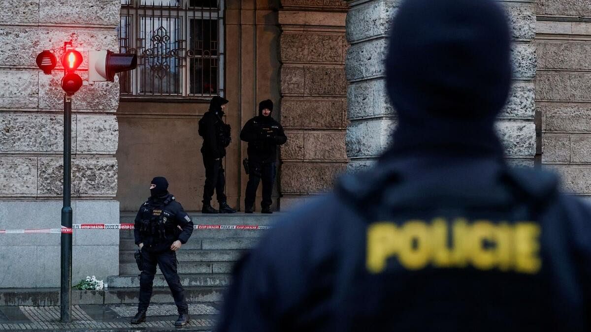 <div class="paragraphs"><p>Members of the Police stand guard following a shooting at one of Charles University's buildings in Prague.</p></div>