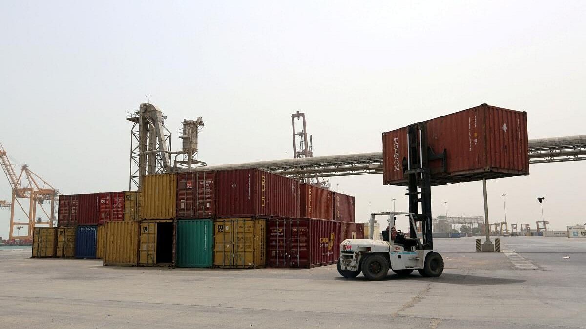 <div class="paragraphs"><p> A forklift carries a shipping container at the Red Sea port of Hodeidah. (Representative image)</p></div>