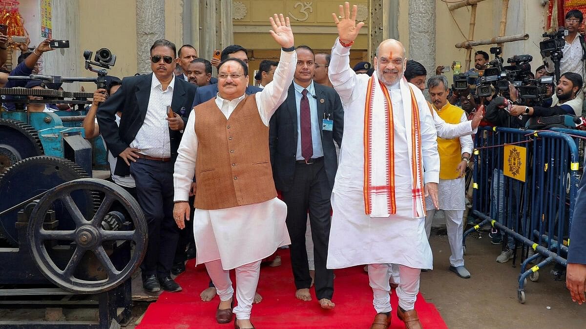 <div class="paragraphs"><p>Union Home Minister Amit Shah and BJP National President JP Nadda at the Kalighat Kali Temple, in Kolkata.</p></div>