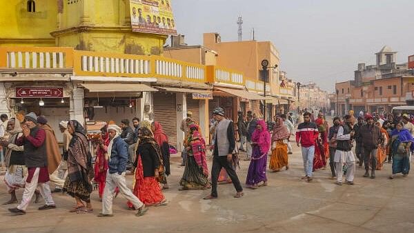 <div class="paragraphs"><p>Devotees arrive at the Ram Temple, in Ayodhya, Wednesday, Dec 27, 2023.</p></div>
