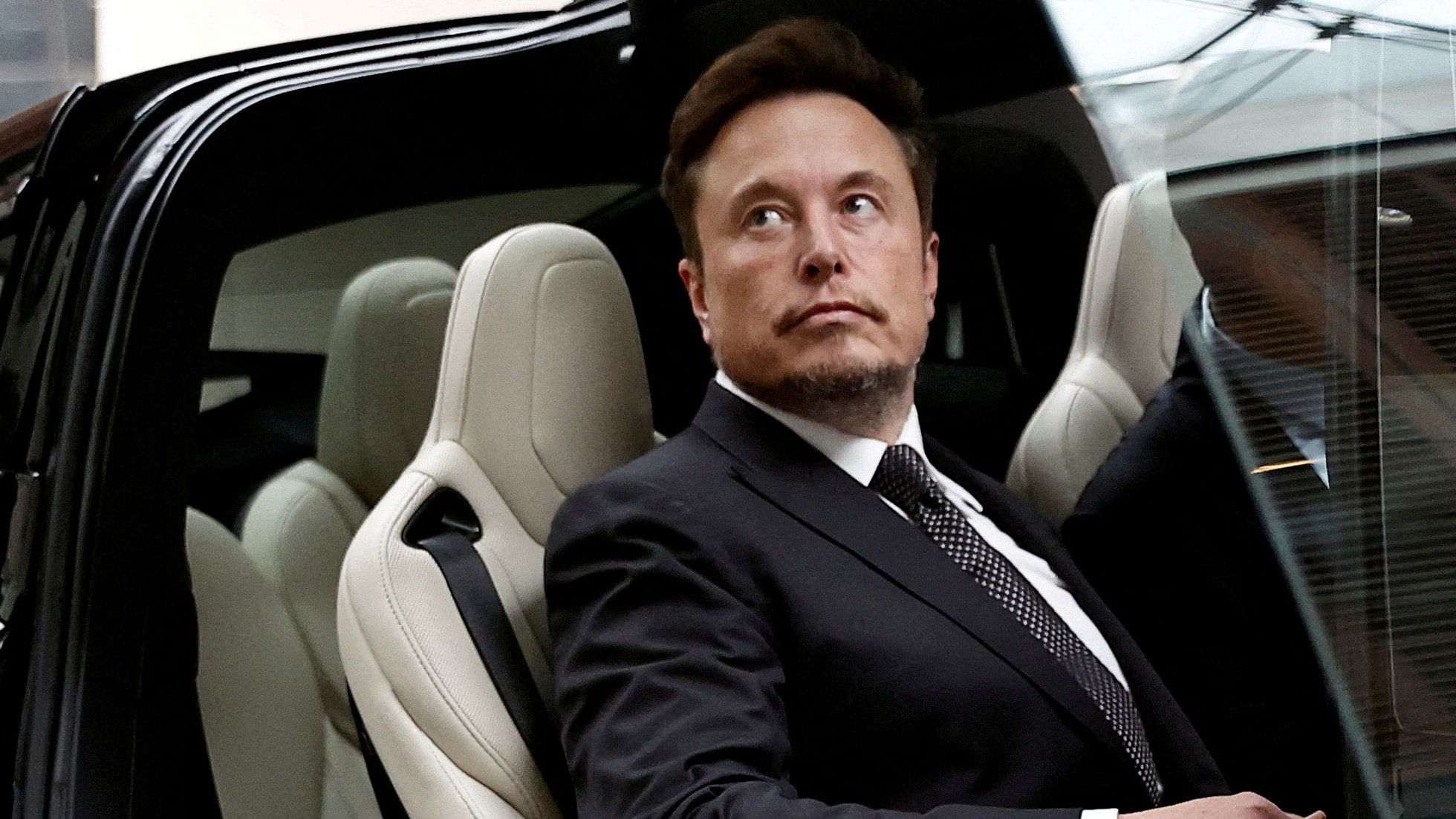 <div class="paragraphs"><p>Tesla Chief Executive Officer Elon Musk gets in a Tesla car </p></div>