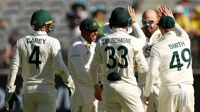 <div class="paragraphs"><p>Australian spinner Nathan Lyon celebrates with teammates after dismissing Pakistan's Abdullah Shafique on the second day of the first Test, on Dec 15, 2023</p></div>