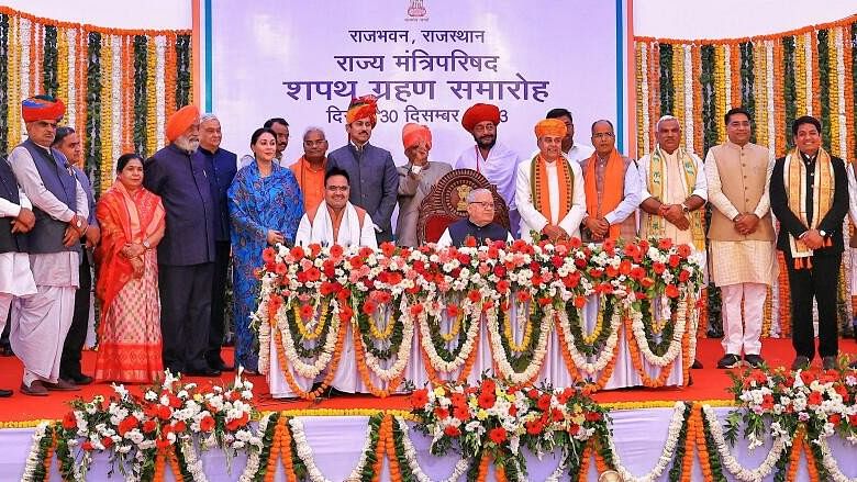 <div class="paragraphs"><p>Rajasthan Governor Kalraj Mishra and Chief Minister Bhajan Lal Sharma with the newly-appointed ministers after the oath ceremony, at Raj Bhawan in Jaipur.&nbsp;</p></div>