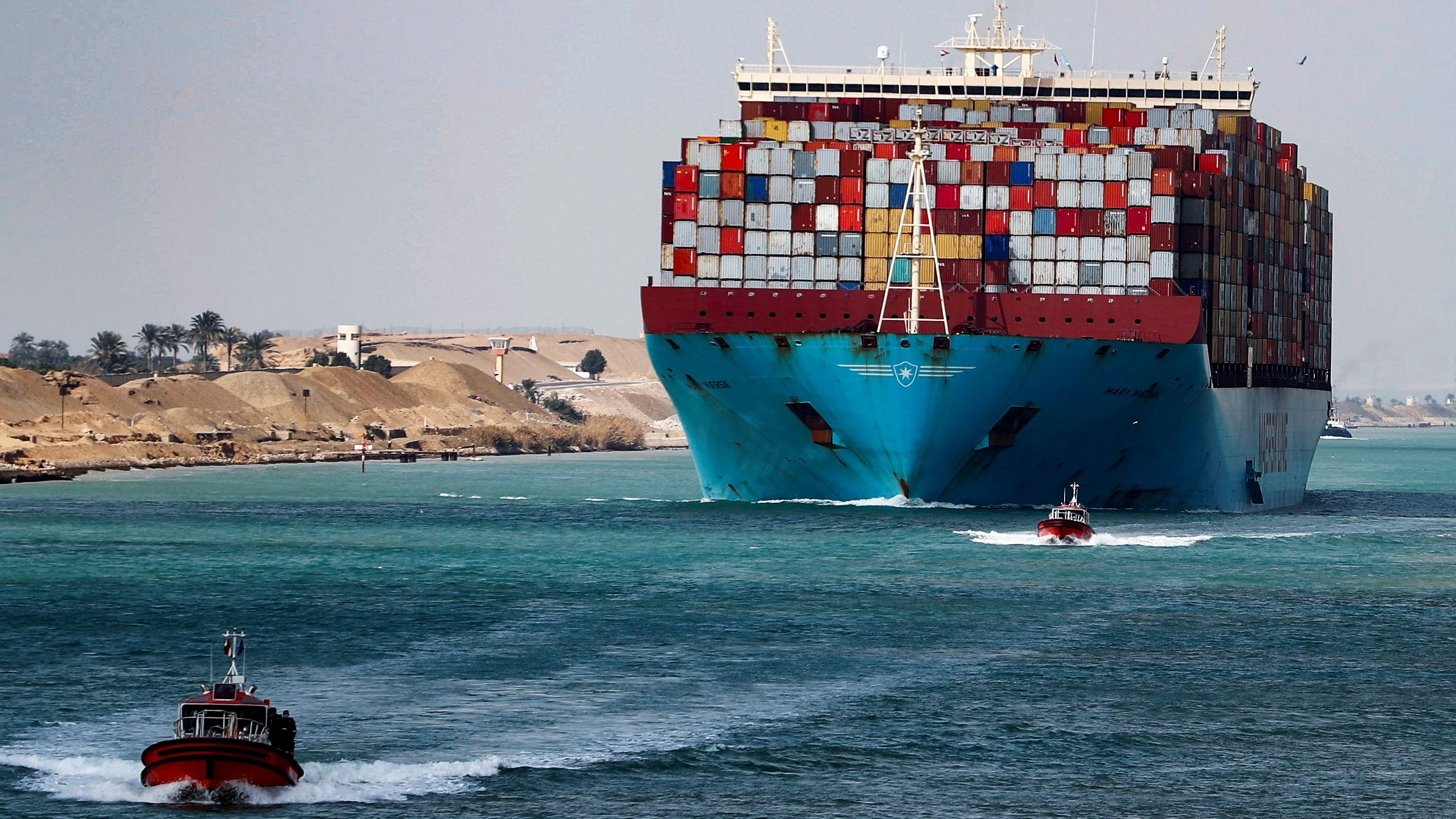 <div class="paragraphs"><p>A shipping container passes through the Suez Canal in Suez, Egypt</p></div>