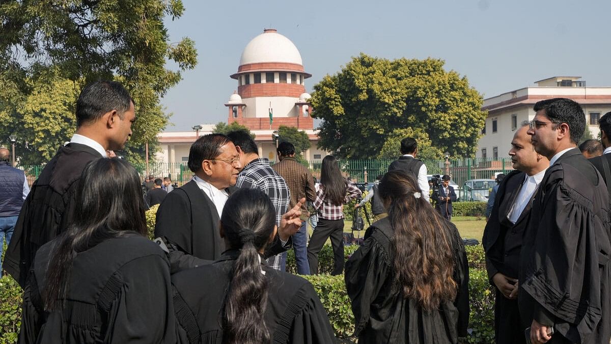 <div class="paragraphs"><p>Lawyers at the Supreme Court complex, on the day of the court's verdict on a batch of petitions challenging the abrogation of Article 370 of the Constitution, in New Delhi.&nbsp;</p></div>