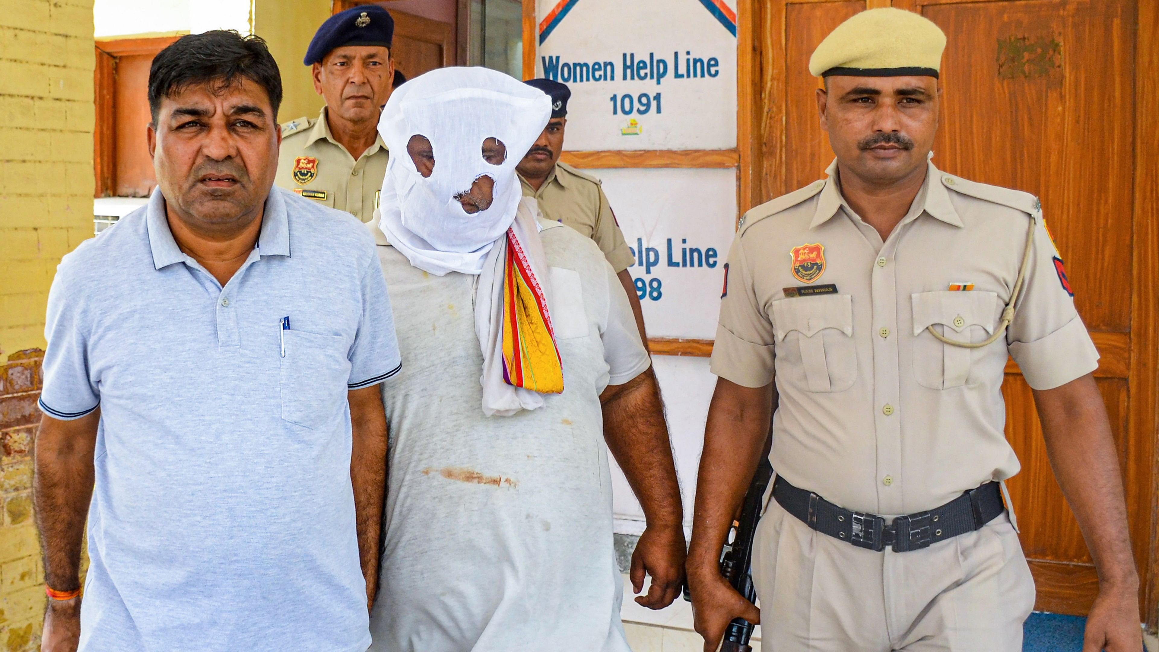 <div class="paragraphs"><p>Cow vigilante Bittu Bajrangi being presented before the Nuh district court a day after his arrest last year.&nbsp;</p></div>