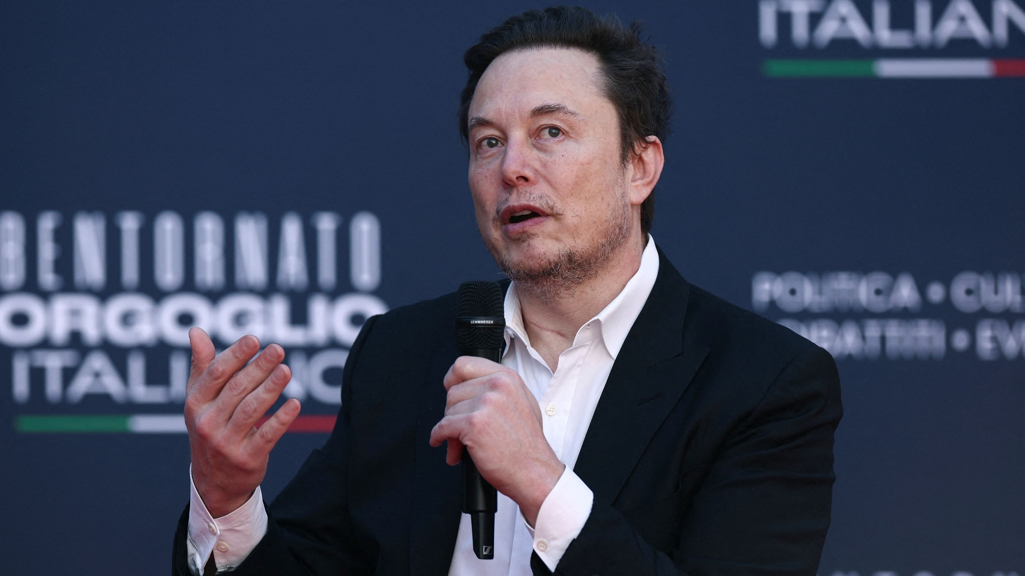 <div class="paragraphs"><p>Tesla and SpaceX's CEO Elon Musk speaks, as he attends political festival Atreju organised by Italian Prime Minister Giorgia Meloni's Brothers of Italy  right-wing party, in Rome, Italy, December 16, 2023. </p></div>
