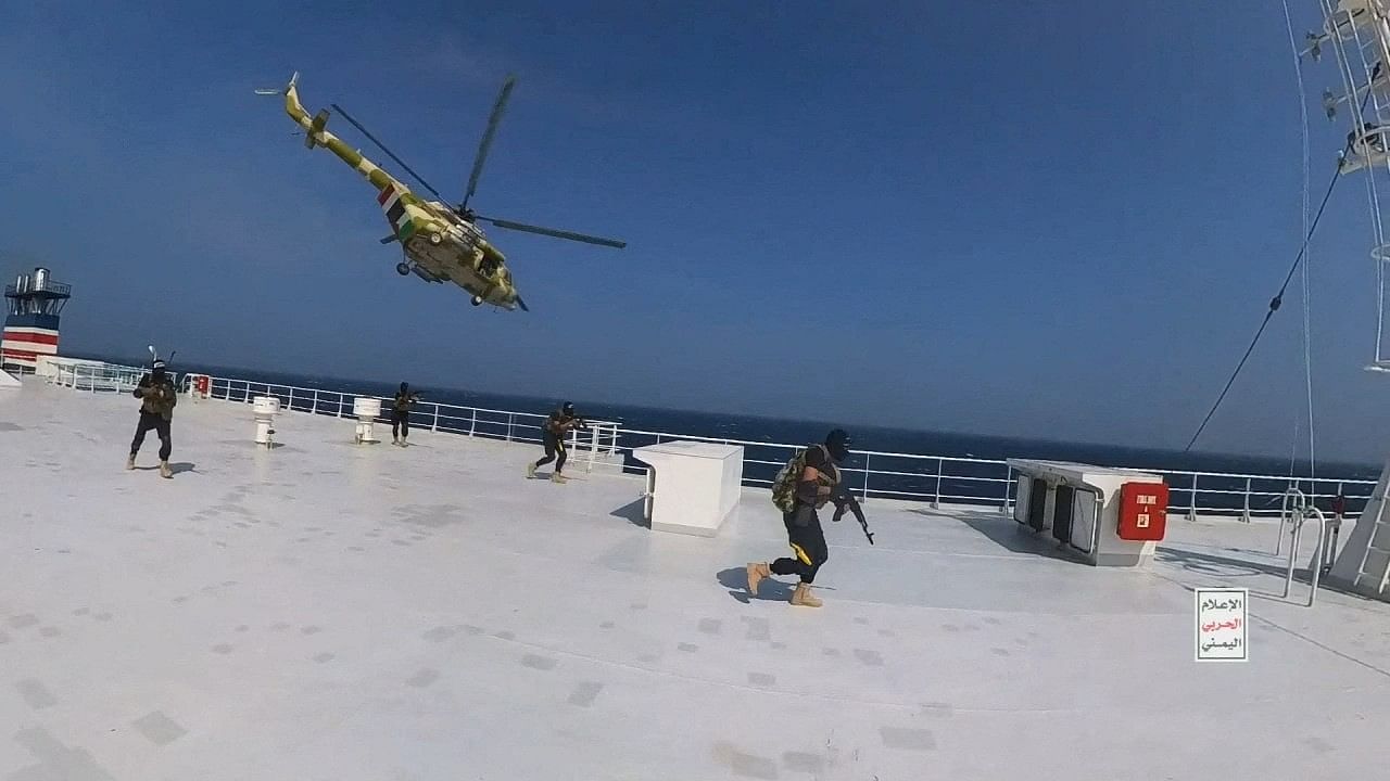 <div class="paragraphs"><p>Houthi military helicopter hovers over the Galaxy Leader cargo ship as Houthi fighters walk on the ship's deck in the Red Sea in this photo released November 20, 2023.</p></div>