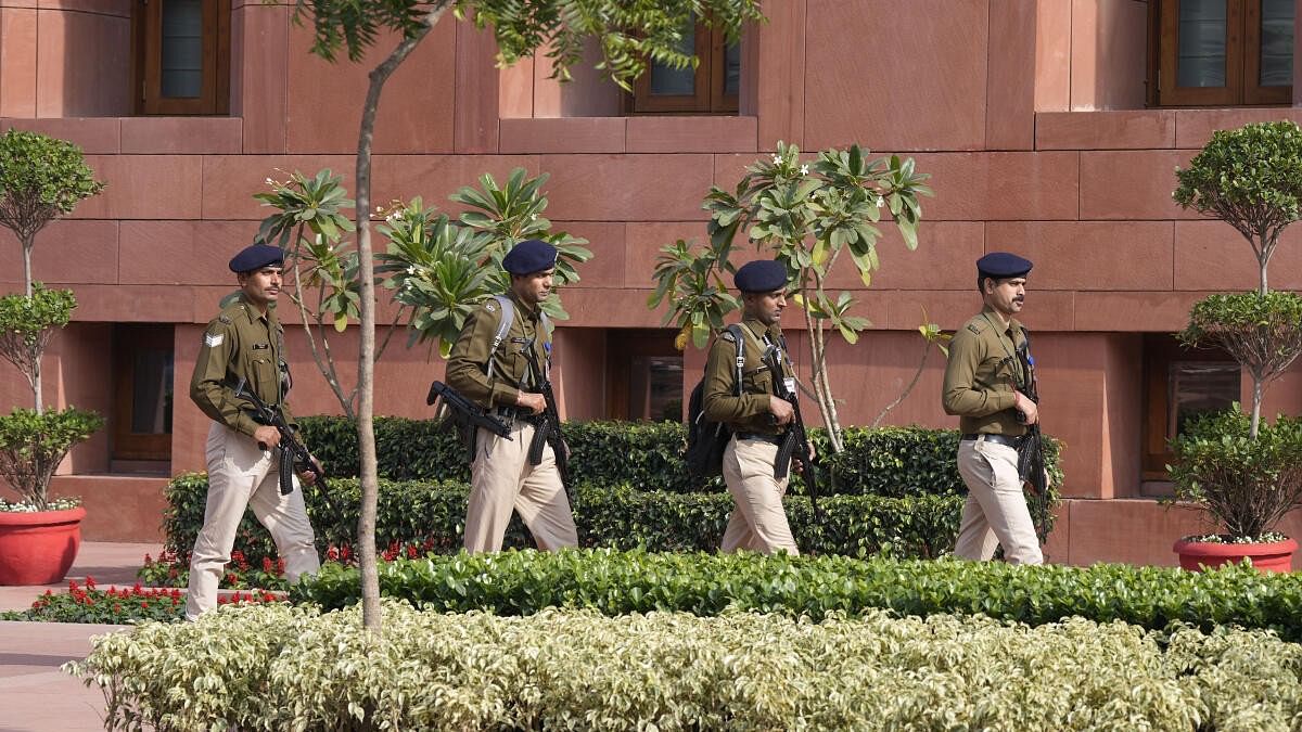 <div class="paragraphs"><p>Armed security personnel patrol the Parliament House premises after a security breach on the anniversary of the 2001 Parliament terror attack on Wednesday.</p></div>