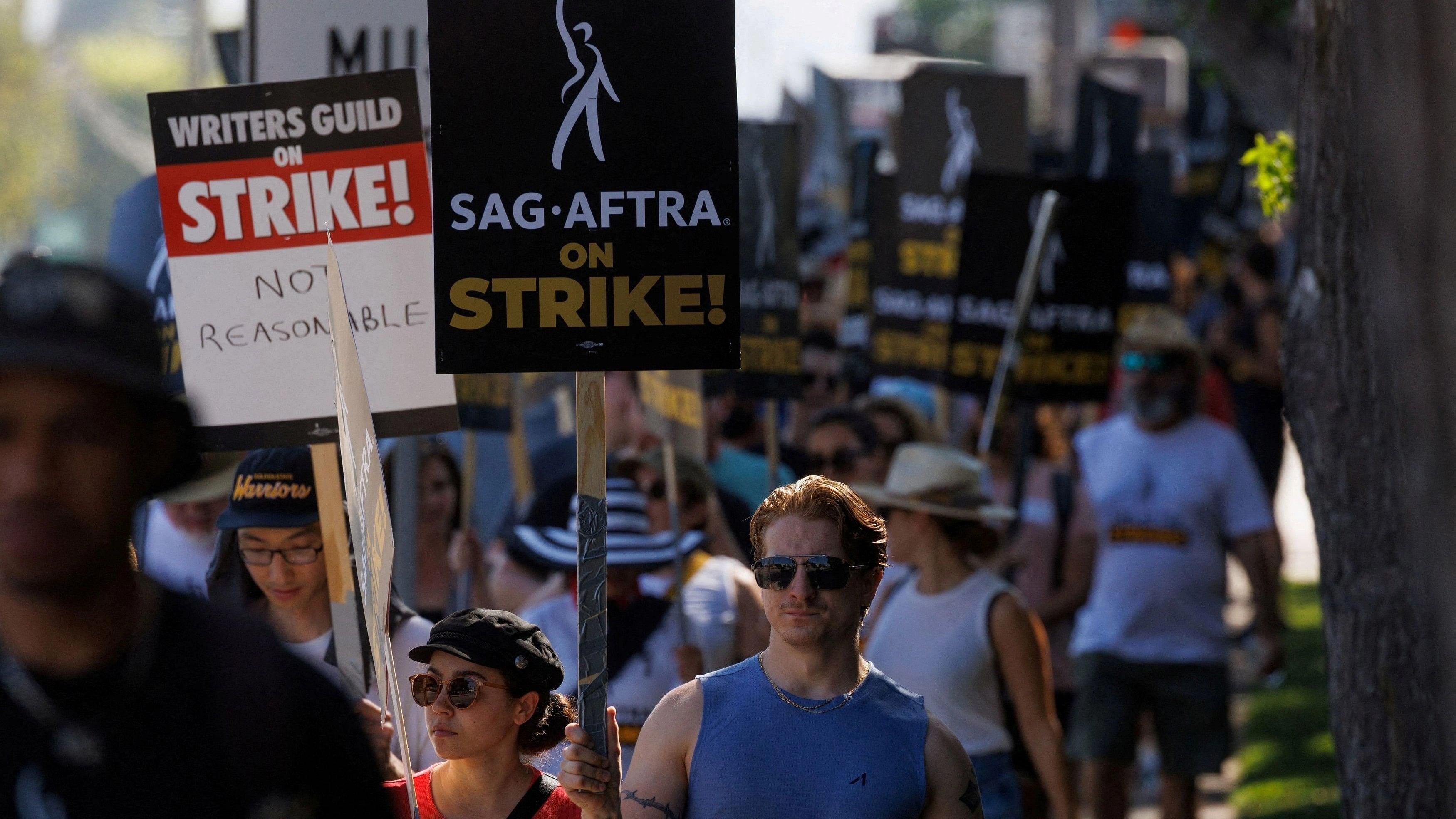 <div class="paragraphs"><p> SAG-AFTRA actors and Writers Guild of America  writers walk the picket line outside Disney Studios in Burbank, California.</p></div>