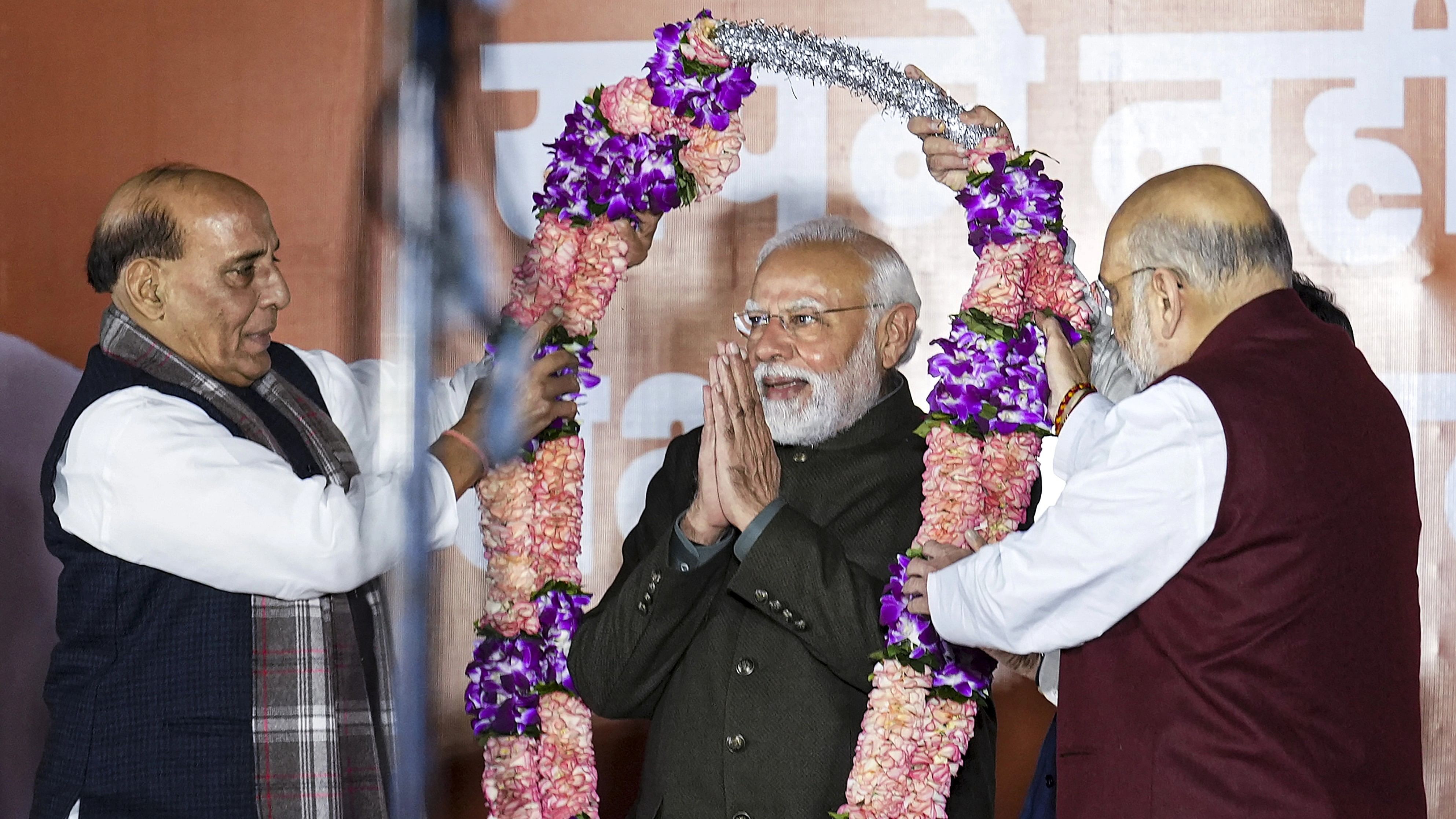 <div class="paragraphs"><p>Prime Minister and senior BJP leader Narendra Modi with Defence Minister Rajnath Singh and Union Home Minister Amit Shah during celebrations after the party's victory in elections to the Legislative Assemblies of Madhya Pradesh, Rajasthan and Chhattisgarh, at BJP headquarters, in New Delhi, Sunday, Dec. 3, 2023. </p></div>