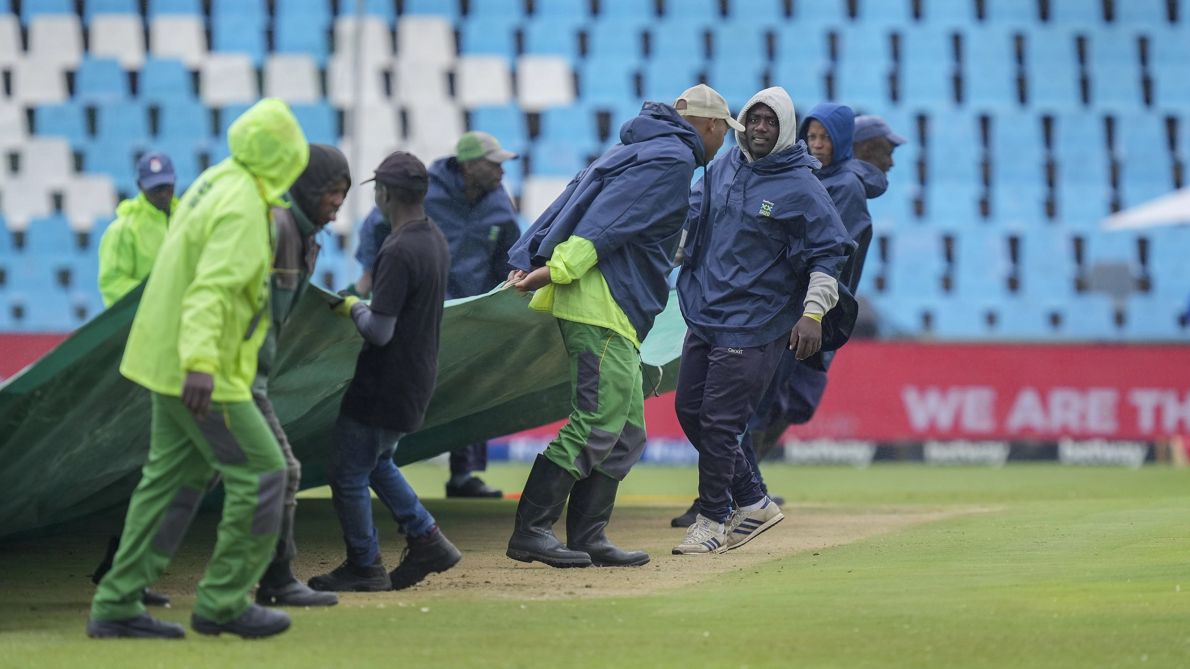 <div class="paragraphs"><p>Centurion: Ground staff brings covers to the ground as the game is delayed due to light rain on the second day of the first Test cricket match between India and South Africa, at SuperSport Park Stadium, in Centurion, Wednesday, Dec. 27, 2023. </p></div>