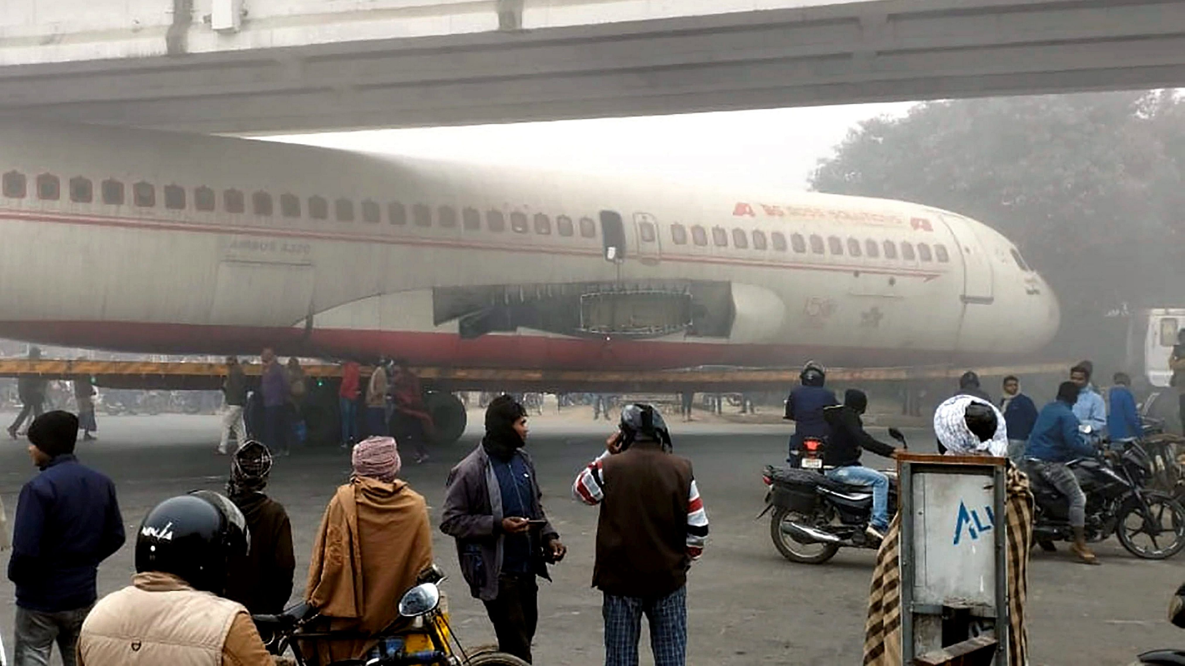 <div class="paragraphs"><p>The body of an airplane&nbsp;that was being transported stuck under a bridge in Bihar's Motihari, Friday, Dec. 29, 2023.</p></div>