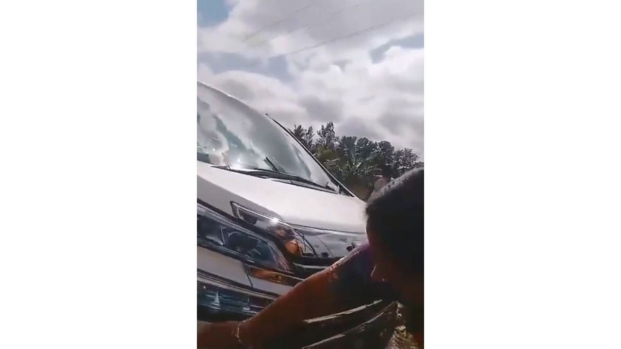 <div class="paragraphs"><p>Screengrab of video showing JD(S) leader&nbsp;Bhavani Revanna examining the damage to her car.</p></div>