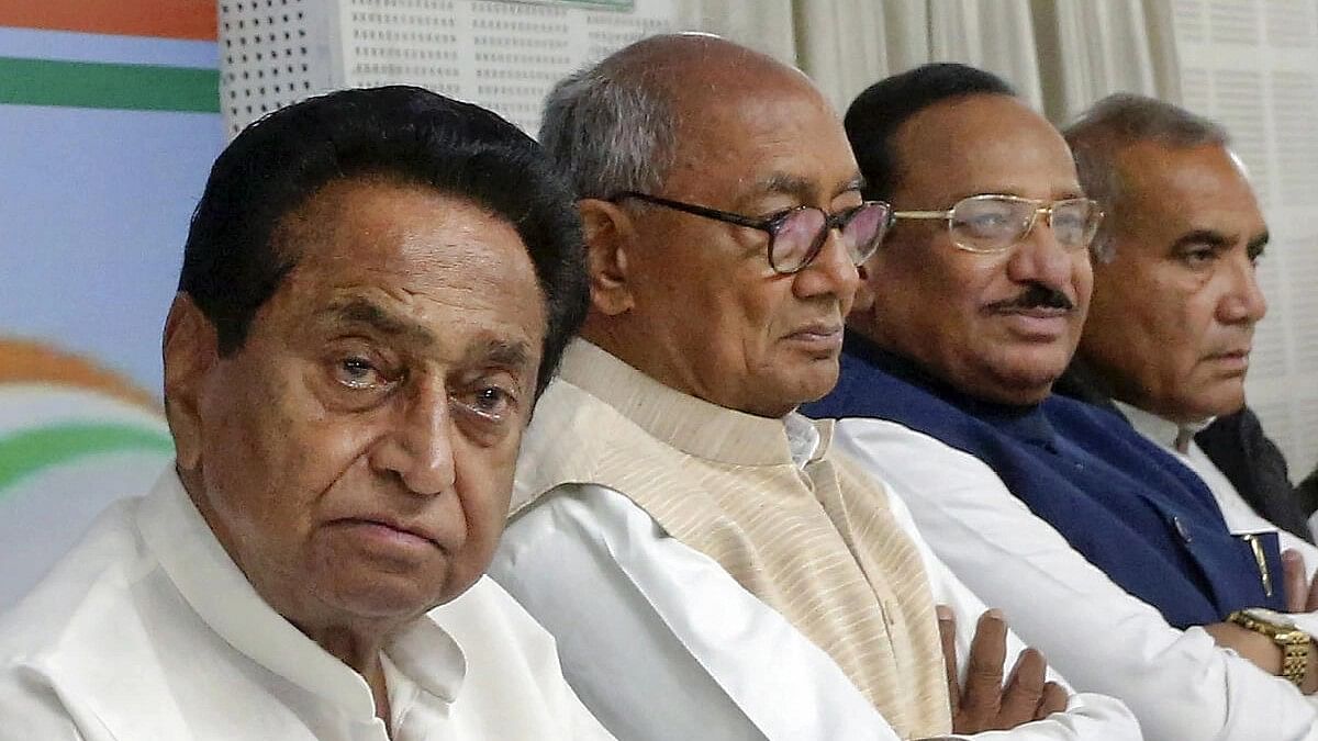 <div class="paragraphs"><p>Congress Madhya Pradesh President Kamal Nath with senior leader Digvijaya Singh and other leaders during a review meeting of party candidates after the party's loss in the State Assembly elections, in Bhopal.</p></div>