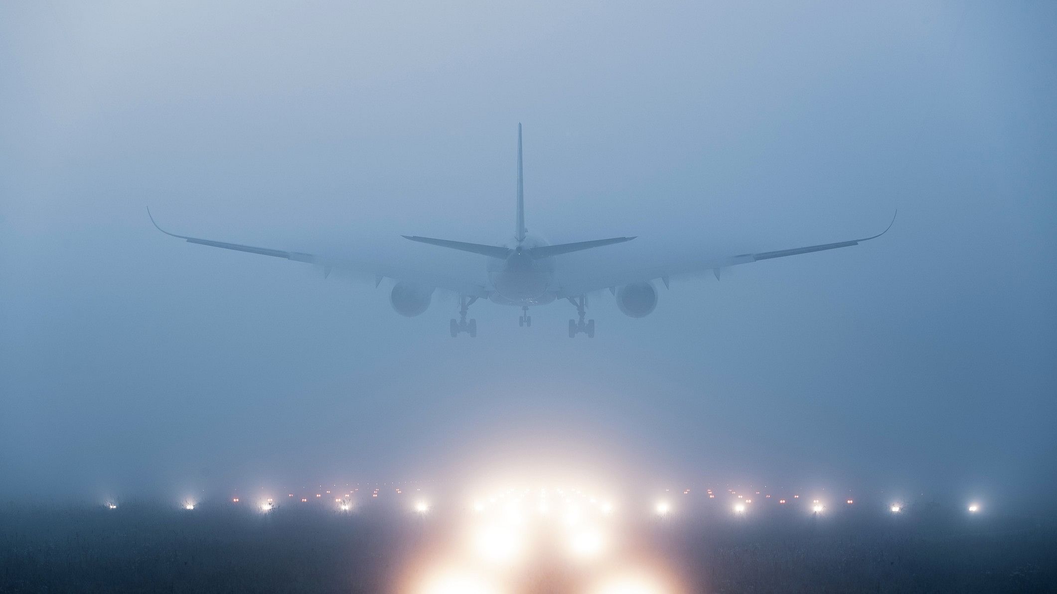 <div class="paragraphs"><p>An airplane landing at a runway amid heavy fog. (Representative image)</p></div>