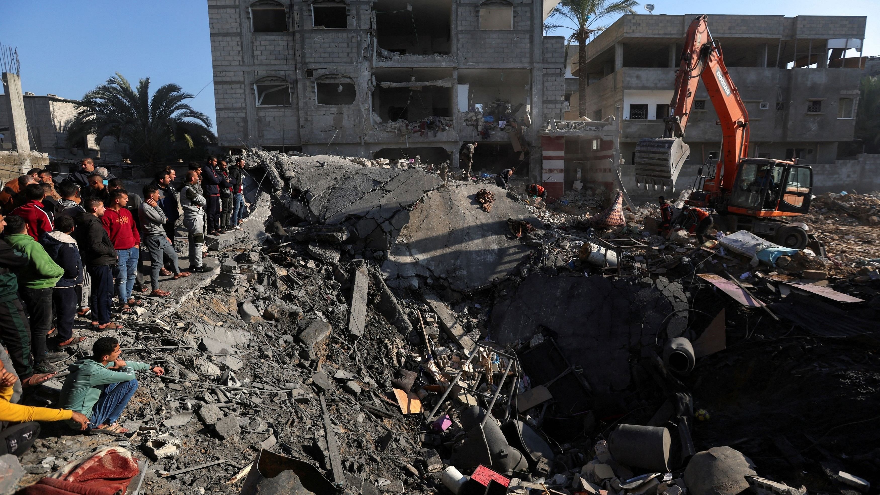 <div class="paragraphs"><p>Palestinians search for casualties at the site of an Israeli strike on a house, amid the ongoing conflict between Israel and the Palestinian Islamist group Hamas, in Rafah, in the southern Gaza Strip.</p></div>