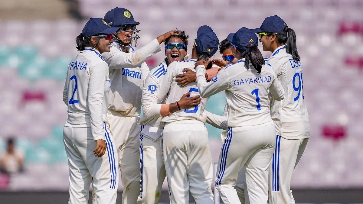 <div class="paragraphs"><p>India Women's Deepti Sharma celebrates with teammates after taking the wicket of England's Lauren Filer on the second day of the one-off cricket Test match between India Women and England Women at DY Patil Stadium, in Navi Mumbai.</p></div>