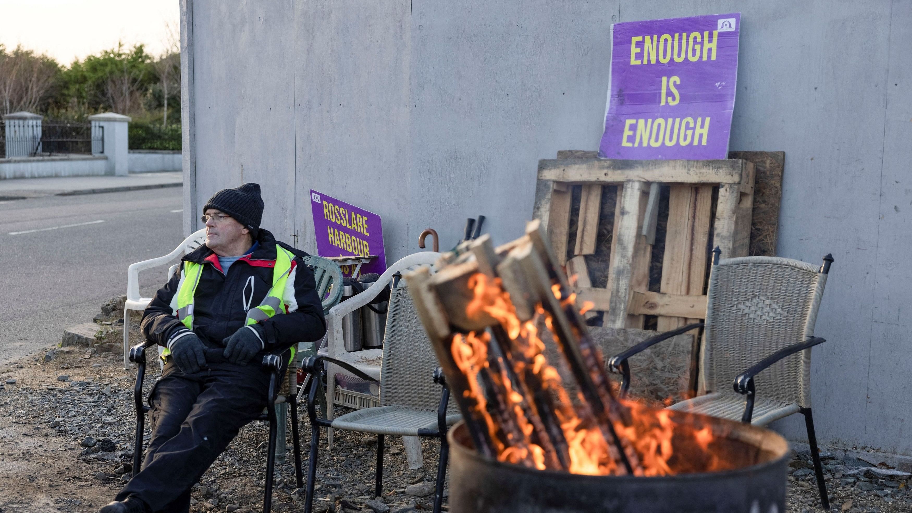 <div class="paragraphs"><p>An old man outside an old hotel that is being converted into an accommodation centre for refugees, in Rosslare Harbour,  December 9, 2023. </p></div>