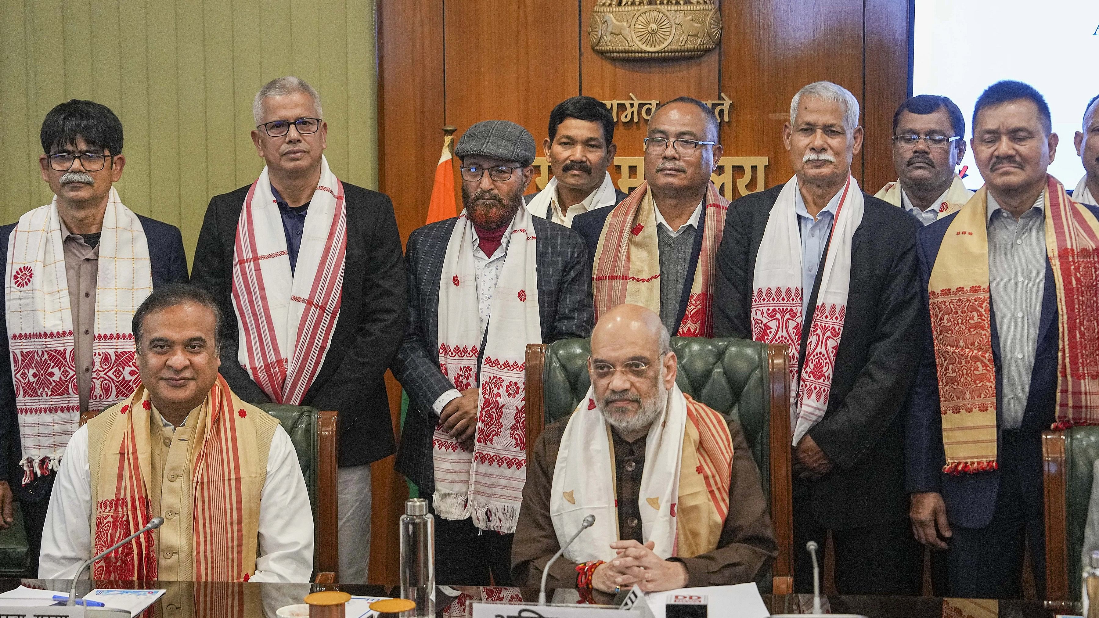 <div class="paragraphs"><p>Union Home Minister Amit Shah and Assam Chief Minister Himanta Biswa Sarma with members of United Liberation Front of Asom (ULFA) during signing of a peace accord between ULFA and the central and Assam governments, in New Delhi, Friday, Dec. 29, 2023. </p></div>