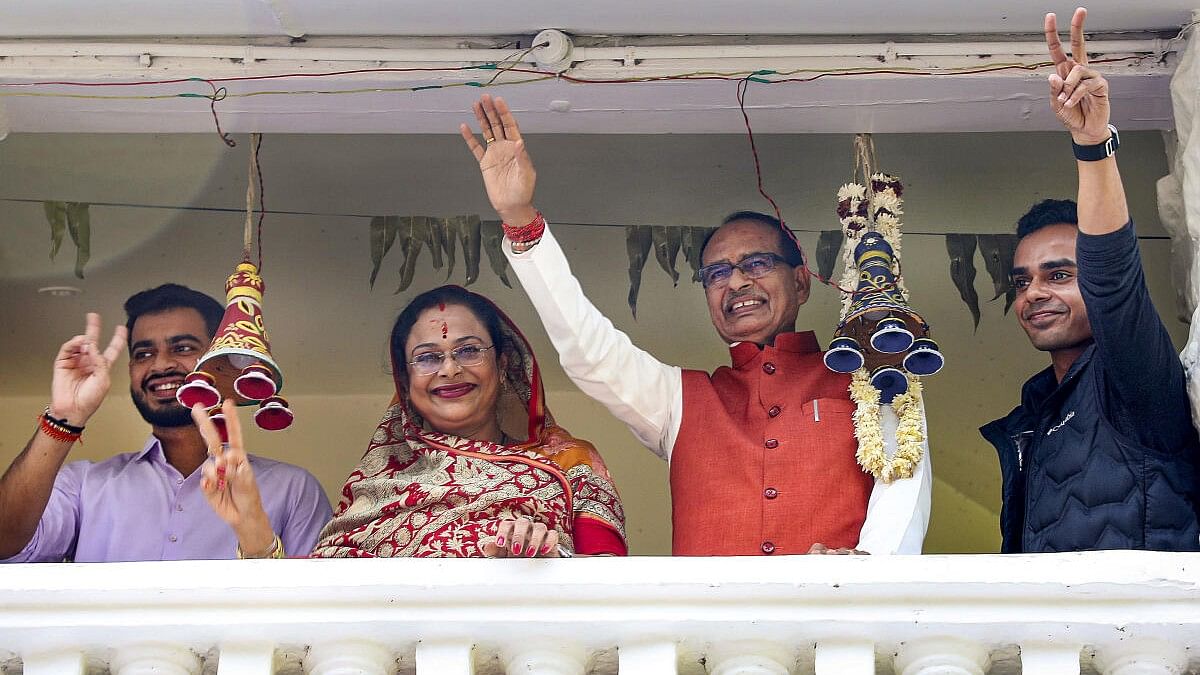 <div class="paragraphs"><p>Madhya Pradesh Chief Minister Shivraj Singh Chouhan with family members celebrates BJP's lead during counting of votes for MP Assembly elections, in Bhopal.&nbsp;</p></div>