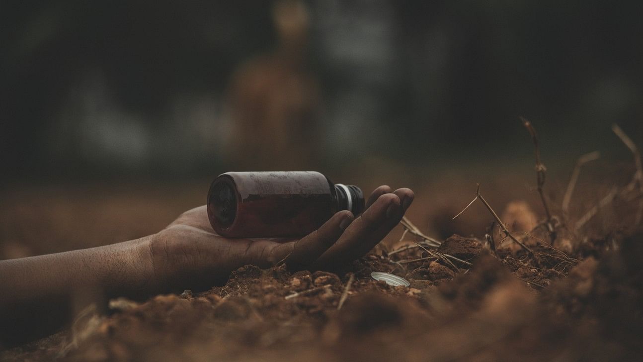 <div class="paragraphs"><p>Representative image showing a poison bottle in the hand of a collapsed person.</p></div>